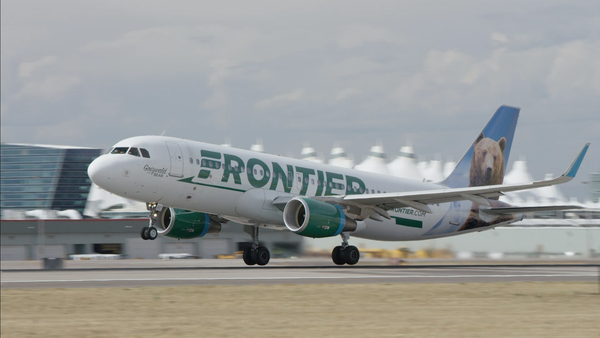 A Frontier Airlines plane taking off.