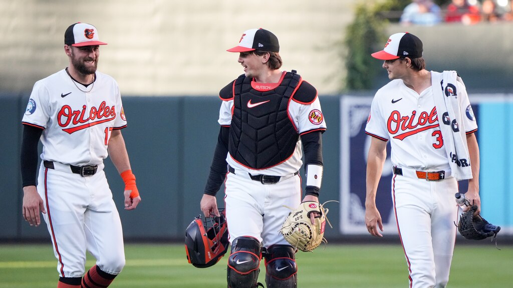 Baltimore Orioles outfielder Colton Cowser (17), catcher Adley Rutschman (35) and starting pitcher Cade Povich (37) head toward the dugout together before a game against the Chicago White Sox at Camden Yards in Baltimore on September 3, 2024.