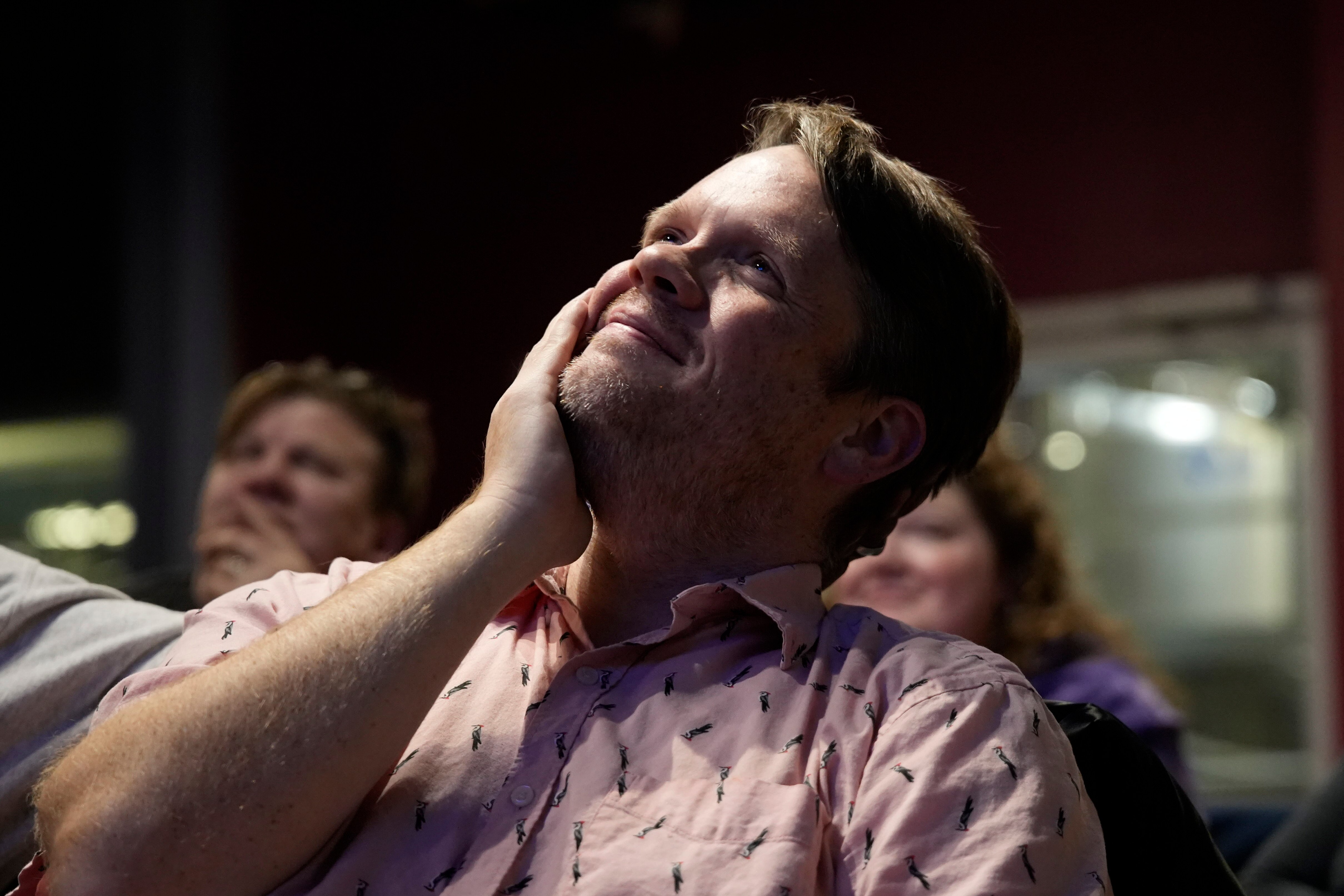 Montgomery County Public Schools teacher Joe Evans watches himself compete on “Jeopardy!” during a watch party at Silver Branch Brewing Co. with his friends and family in Silver Spring on Tuesday.