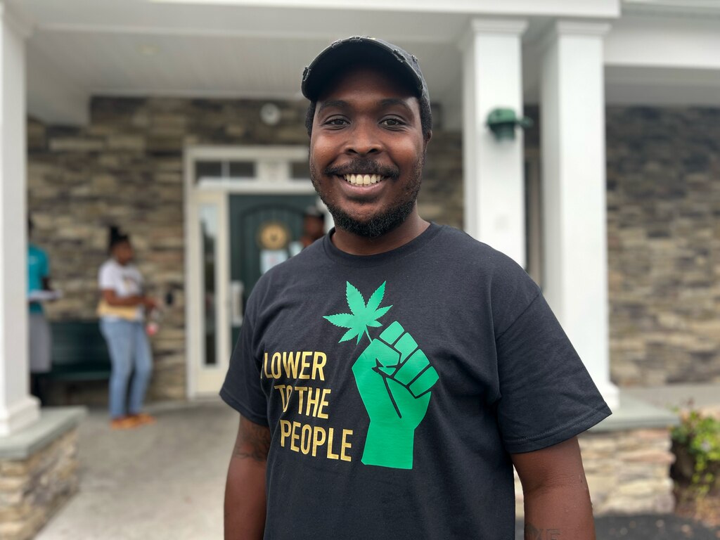 Gabriel Ali-el, a manager at Blair Wellness Center on York Road, stands for a portrait outside the dispensary on July 1, 2023.