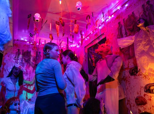 Alice Christianson, 12 years old, and Julia Pulsifer, 13 years old, walk through the gore filled haunted house of the Agouridis family in Silver Spring. The family have decorated thier home for 13 years for Halloween.