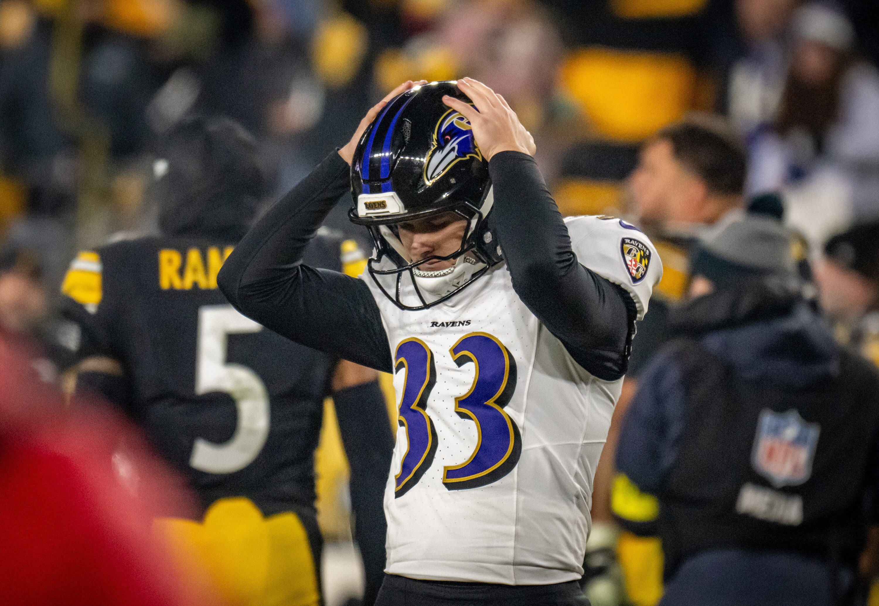 Ravens kicker Tyler Loop reacts after missing what would have been a game-winning field goal. The Steelers defeated the Ravens 26-24 on Sunday night.