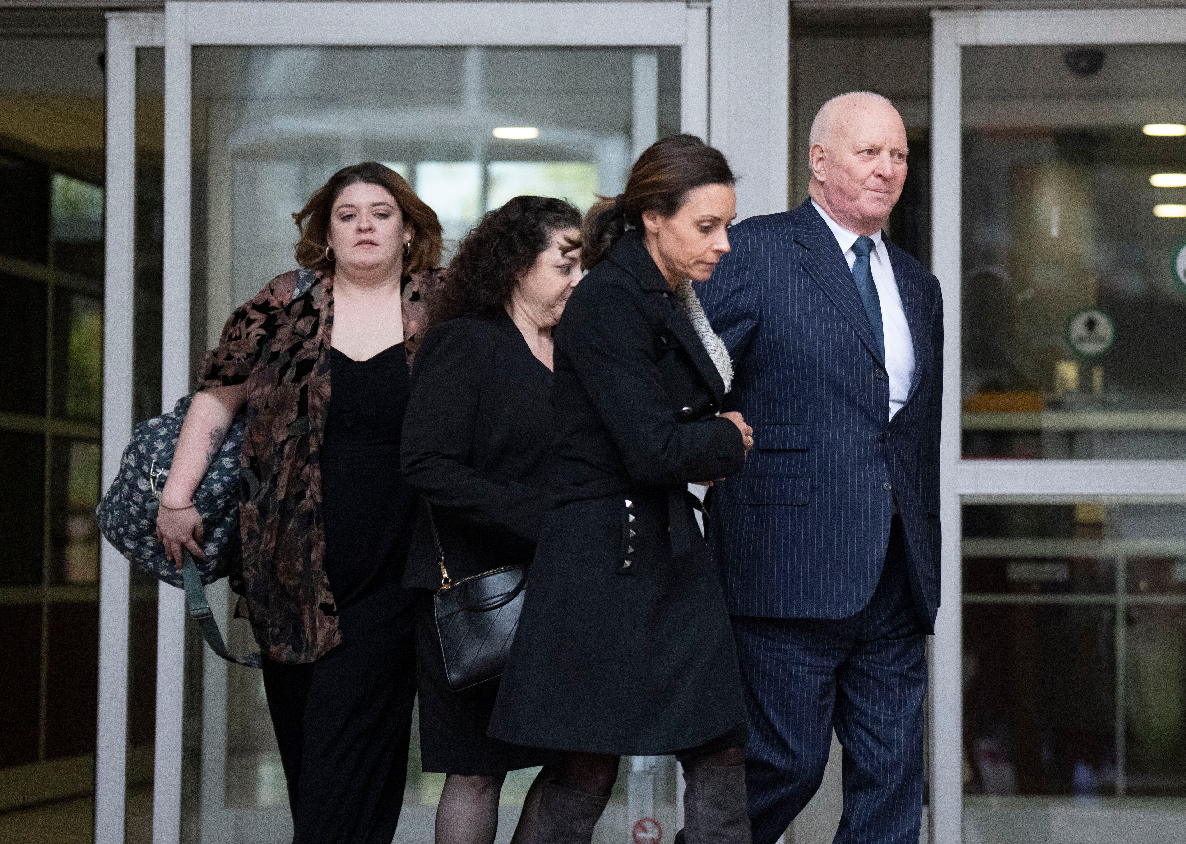 Attorney Stephen L. Snyder, at right, leaves court in November.
