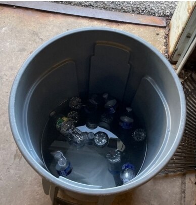 An industrial trash can filled with melted ice and bottled water was found at a Baltimore Department of Public Works facility in south Baltimore, July 10, 2024.