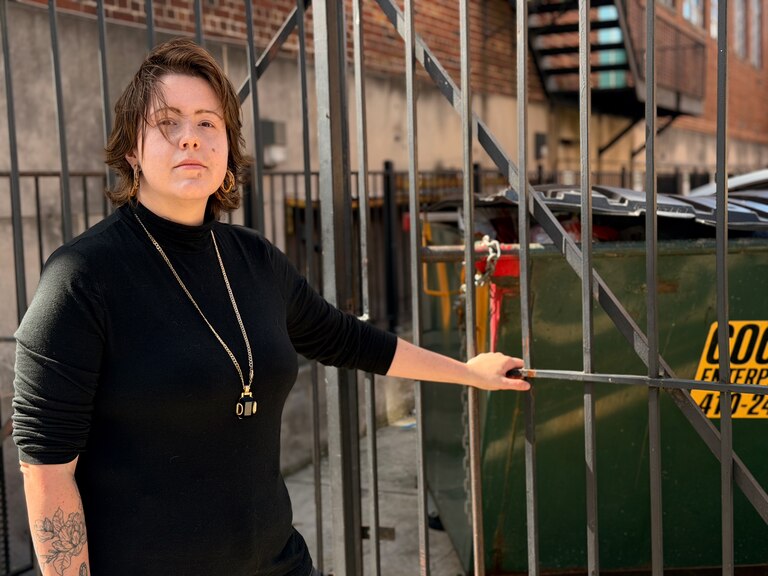 Hannah Kincannon, a Baltimore witch, poses for a portrait after cleaning up trash from her neighborhood.