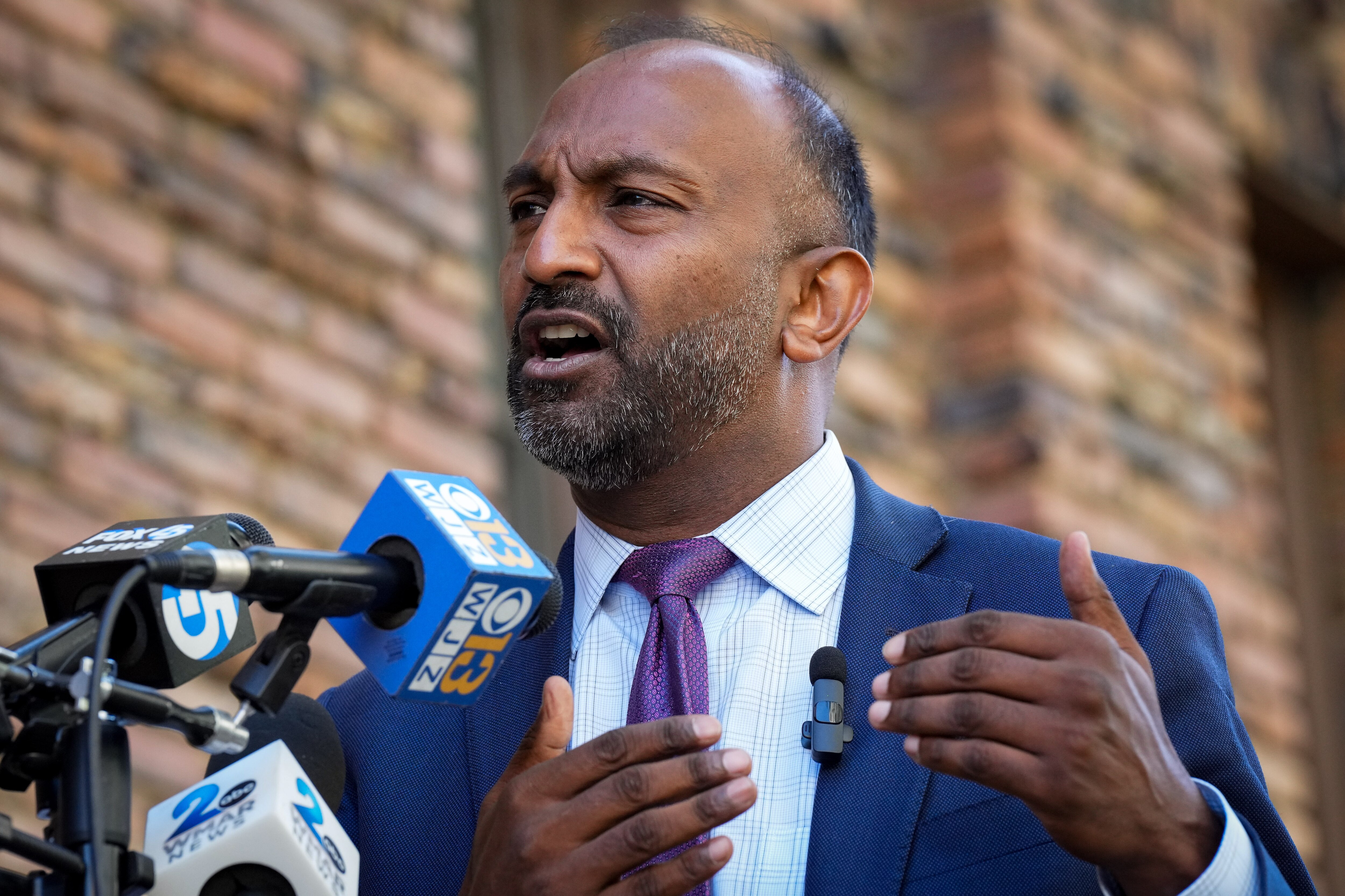 Attorney Thiru Vignarajah speaks with reporters during a press conference across the street from the Baltimore Archdiocese building on Tuesday, April 18.