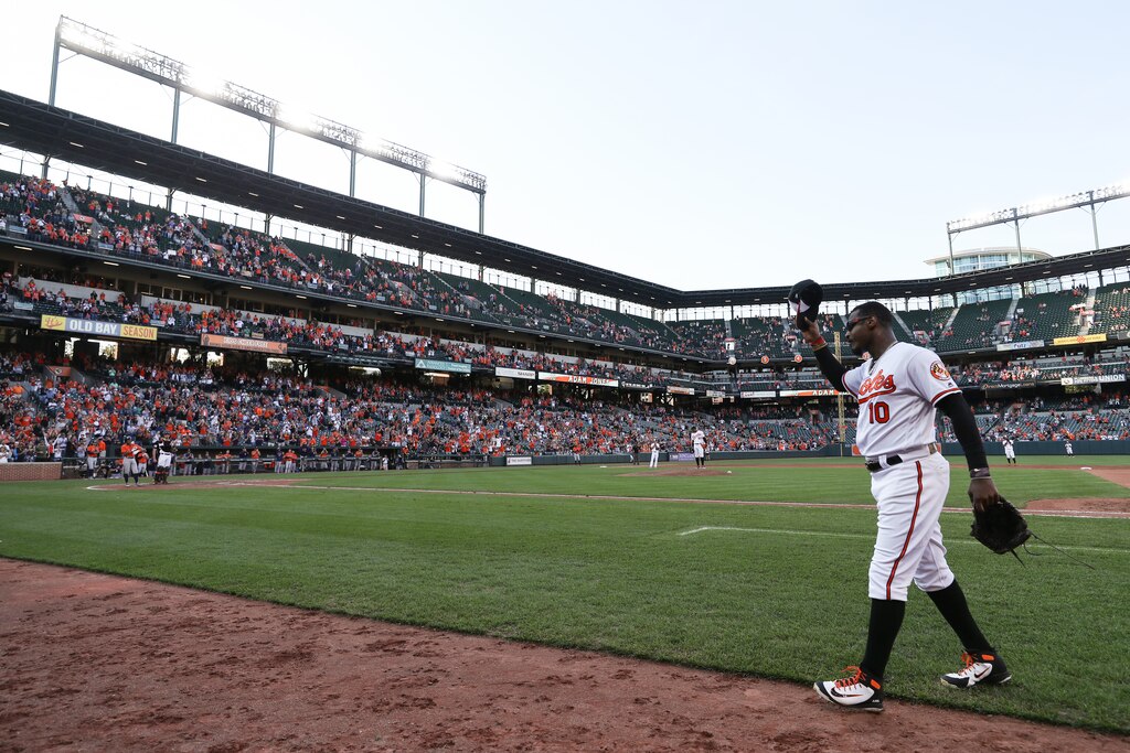BALTIMORE, MD - SEPTEMBER 30: Adam Jones #10 of the Baltimore Orioles waves to crowd after being pulled from the game in the ninth inning against the Houston Astros at Oriole Park at Camden Yards on September 30, 2018 in Baltimore, Maryland.