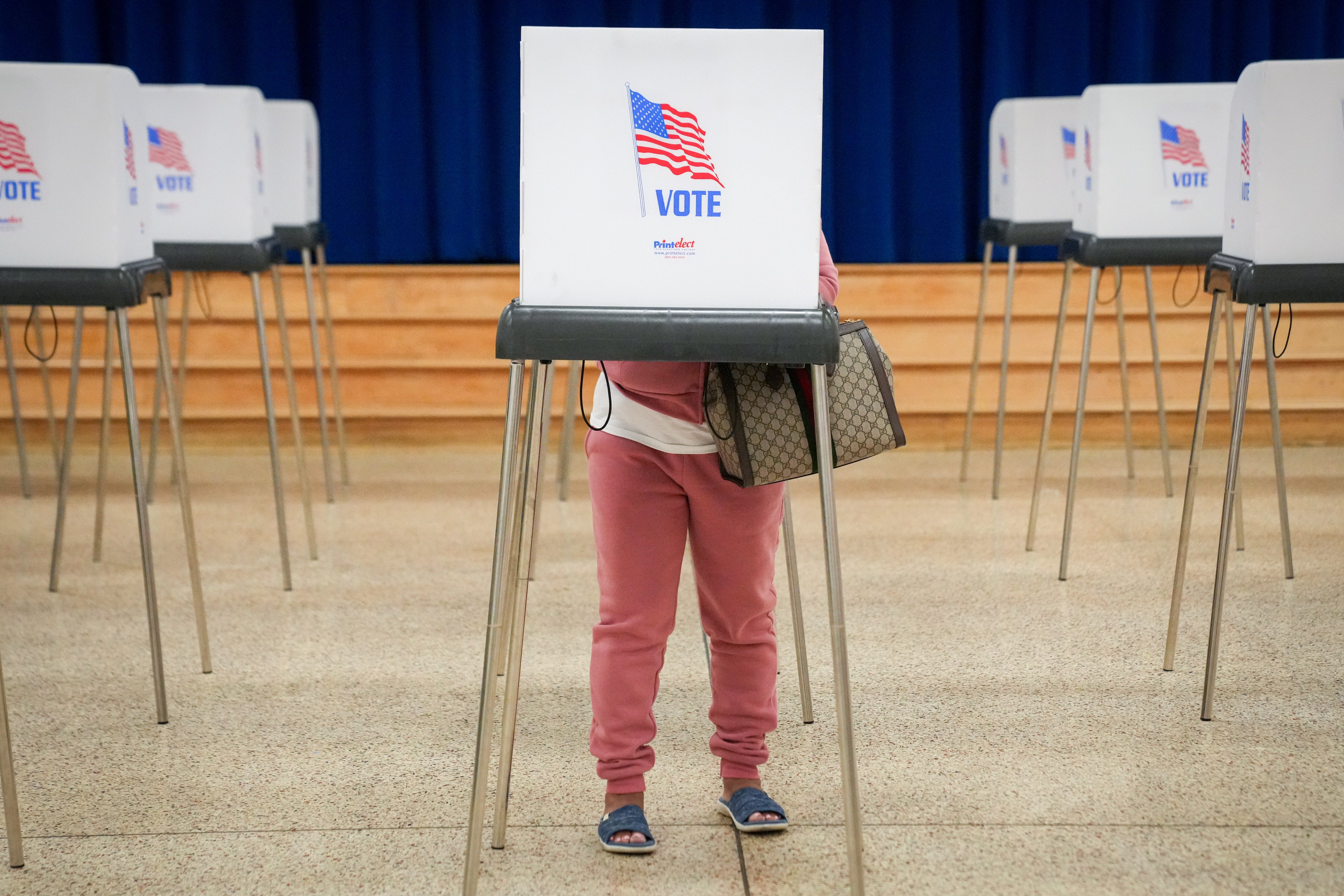 A woman votes at a polling booth at Deer Park Elementary School in Owings Mills on Maryland’s Primary Election Day on May 14, 2024.