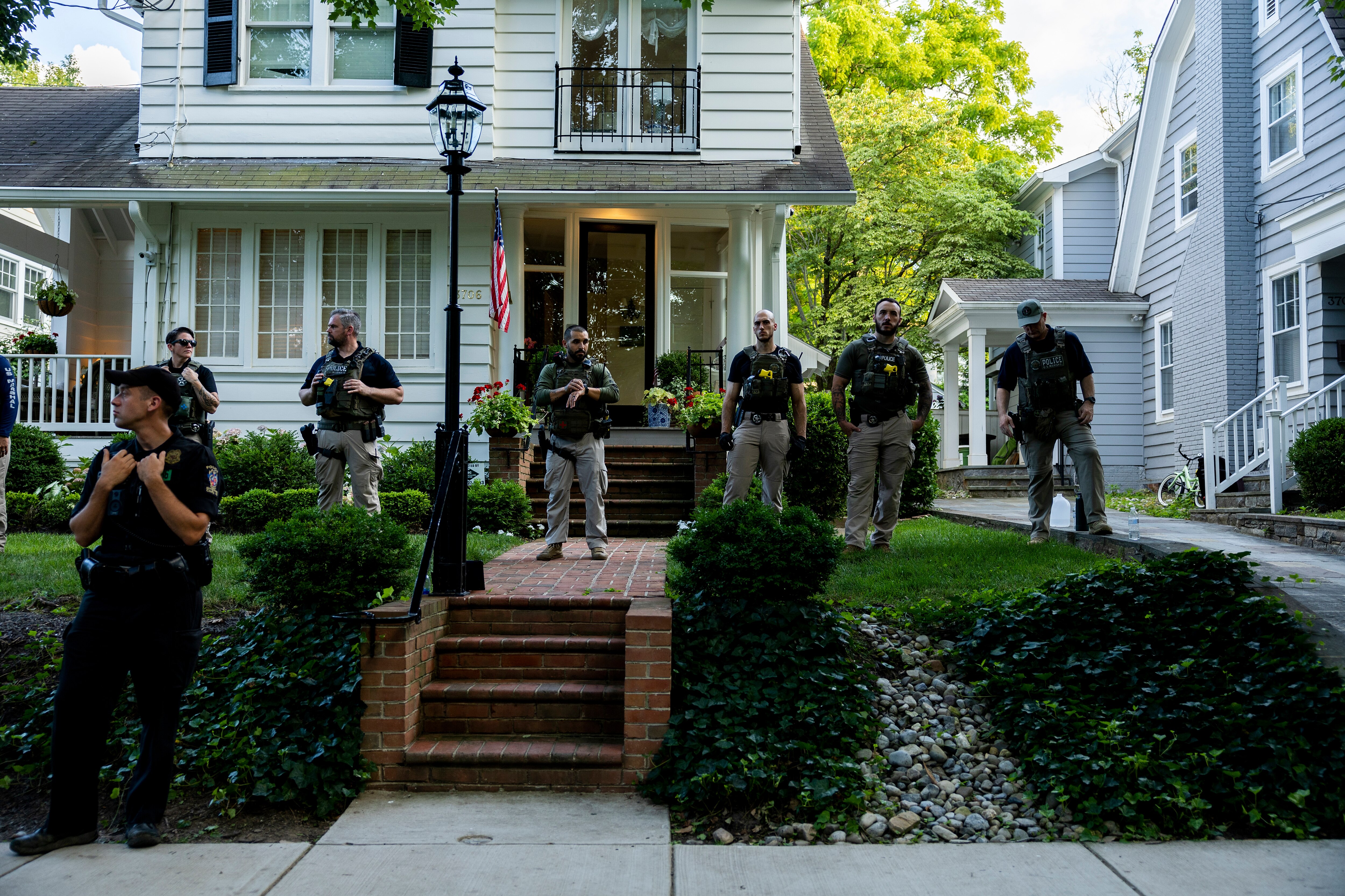 CHEVY CHASE, MARYLAND - JUNE 29: Law enforcement officers stand guard as abortion rights activists with Our Rights DC march in front of Supreme Court Justice Brett Kavanaugh's house on June 29, 2022 in Chevy Chase, Maryland. Over the last couple months, abortion rights activists have staged protests against the five conservative U.S. Supreme Court Justices. The Supreme Court’s recent decision in the Dobbs v Jackson Women’s Health case overturned the 50-year-old Roe v Wade case and erased federal protection to abortion. (Photo by Anna Moneymaker/Getty Images)