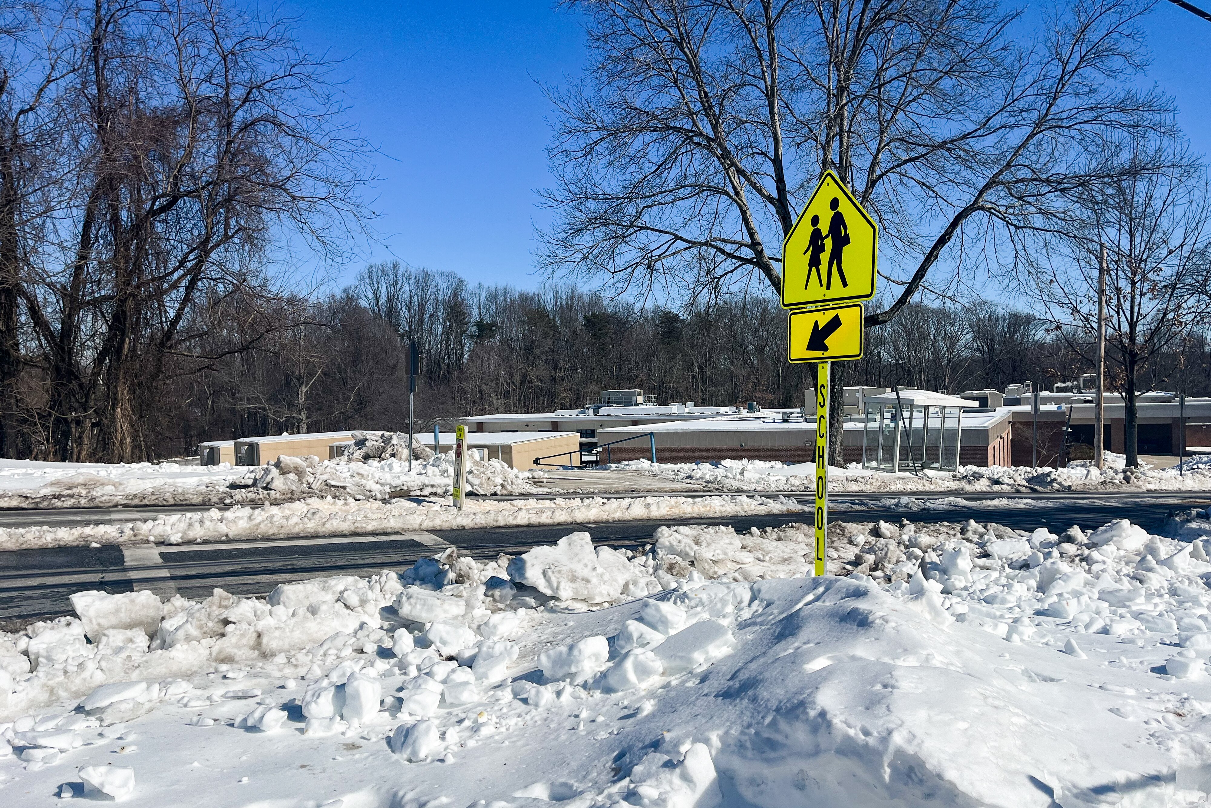 An ice-covered crosswalk in Rockville shows the road conditions that Montgomery County Public Schools are evaluating before deciding to open campuses