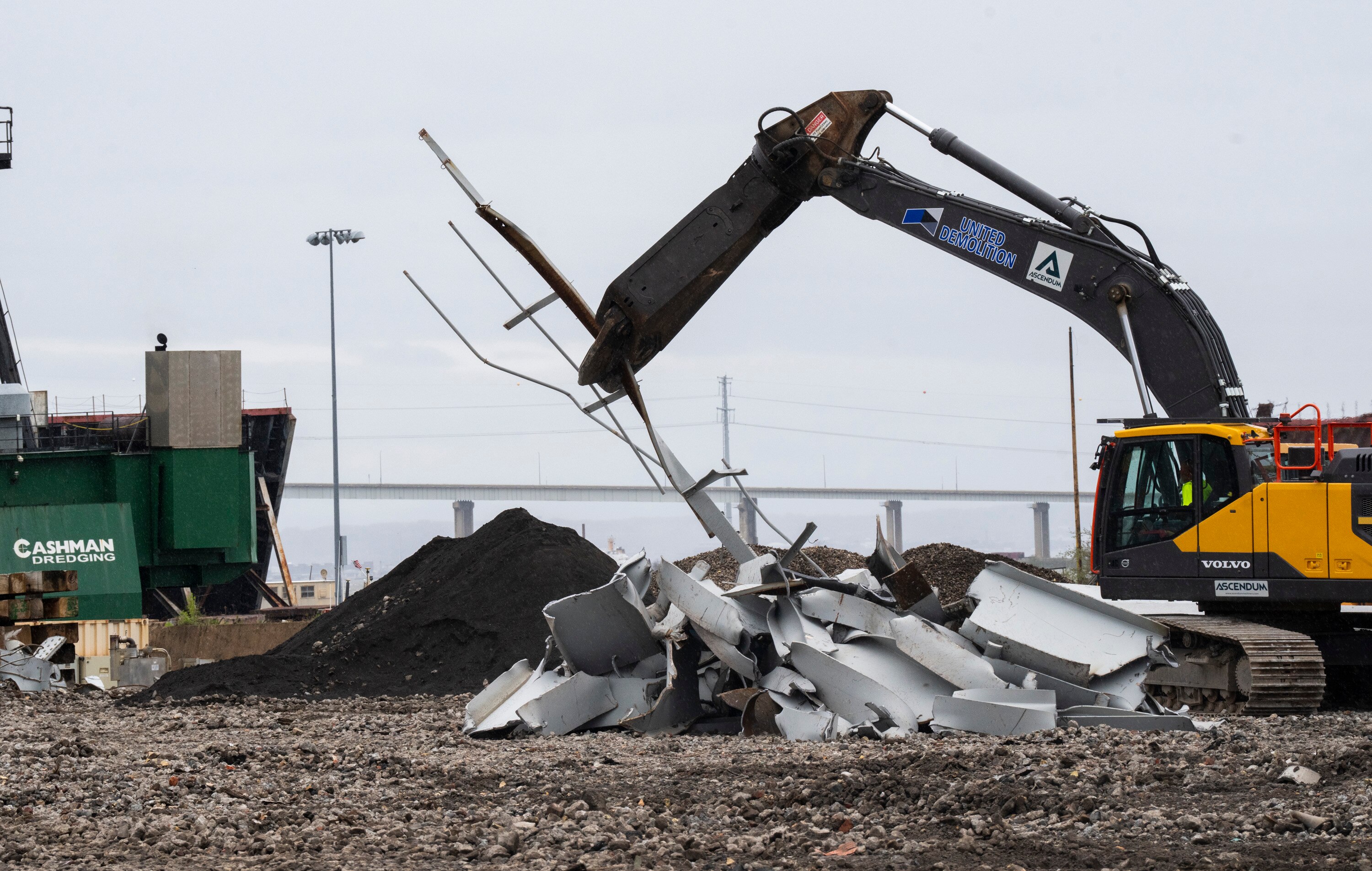 Workers cut up the remanants of the Francis Scott Key Bridge to prepare them to be recycled on April 12, 2024 a few weeks after the collapse. . The pieces are gathered from the water and taken to the port of Tradepoint Atlantic, which sits directly adjacent to where the bridge once stood. 