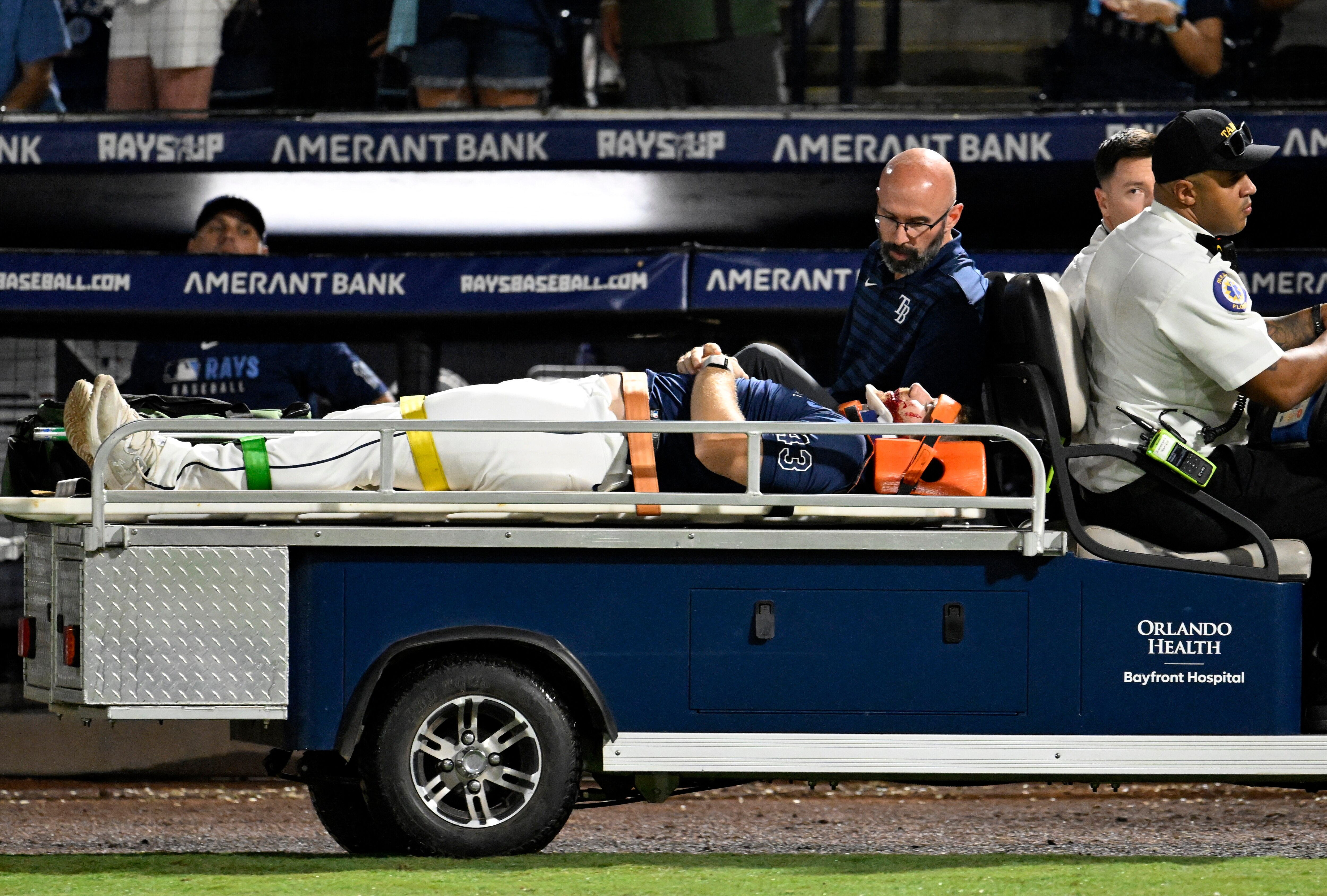Hunter Bigge of the Rays leaves the field on a cart after being hit by a foul ball in the dugout.
