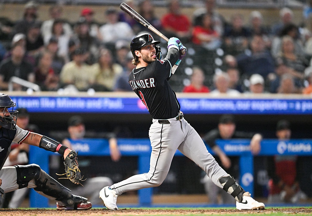 Blaze Alexander #9 of the Arizona Diamondbacks hits a two-run RBI double against the Minnesota Twins in the tenth inning on Sept. 13, 2025.