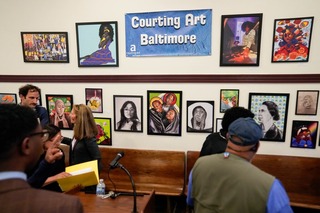 Event attendees check out some of the student artwork on display during the annual Courting Art Baltimore contest at the Eastside District Court building in Baltimore, Md. on Tuesday, May 13, 2025.