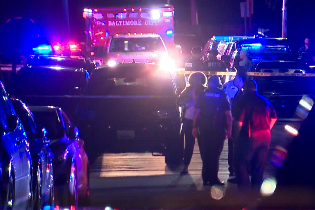 SATURDAY AUG 9 2025 - Police and first responders in the Park Heights neighborhood of Baltimore after a mass shooting Saturday night left one person dead and five others injured.