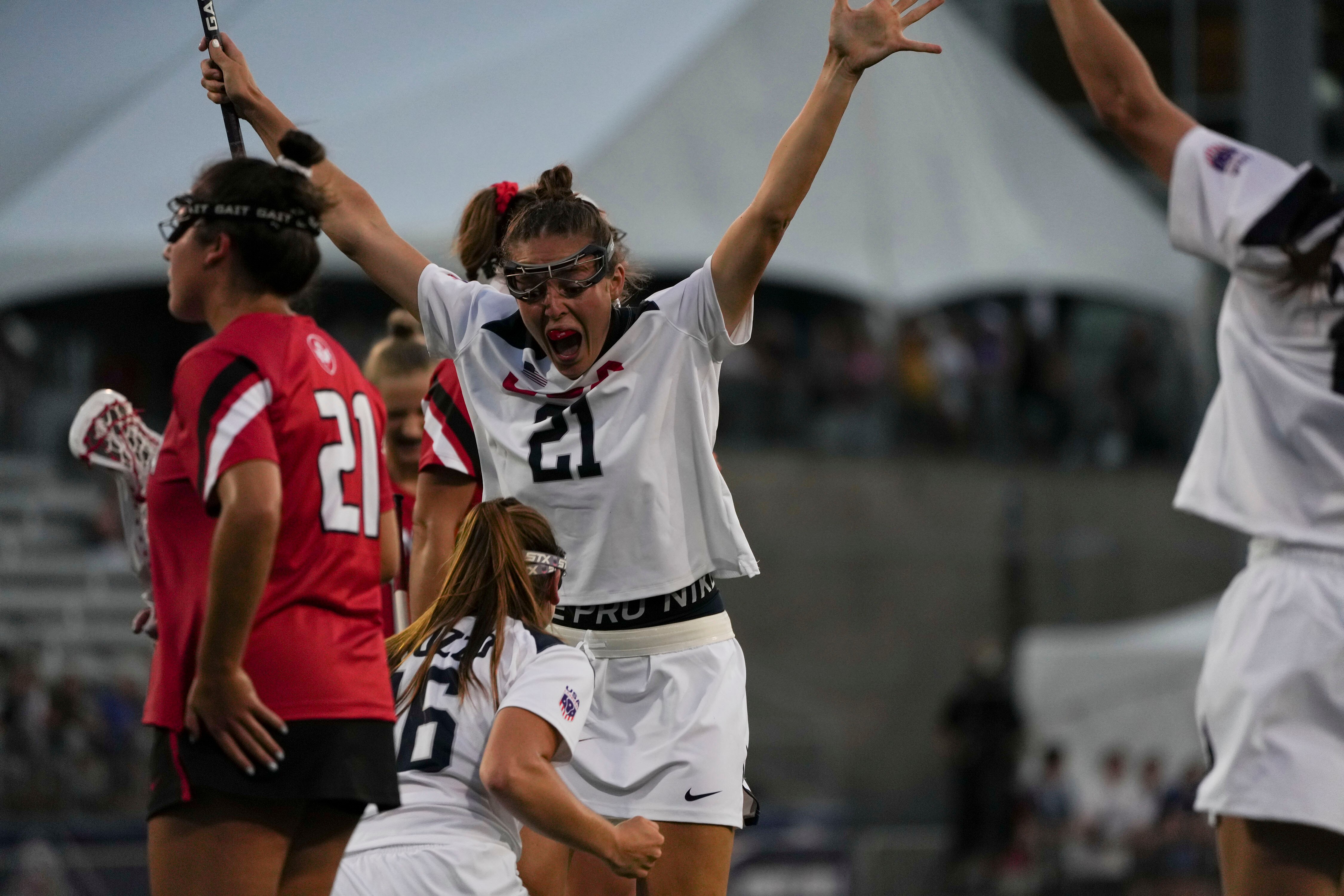 Taylor Cummings celebrates after USA scores against Canada during the first game of the World Lacrosse Women's World Championship.