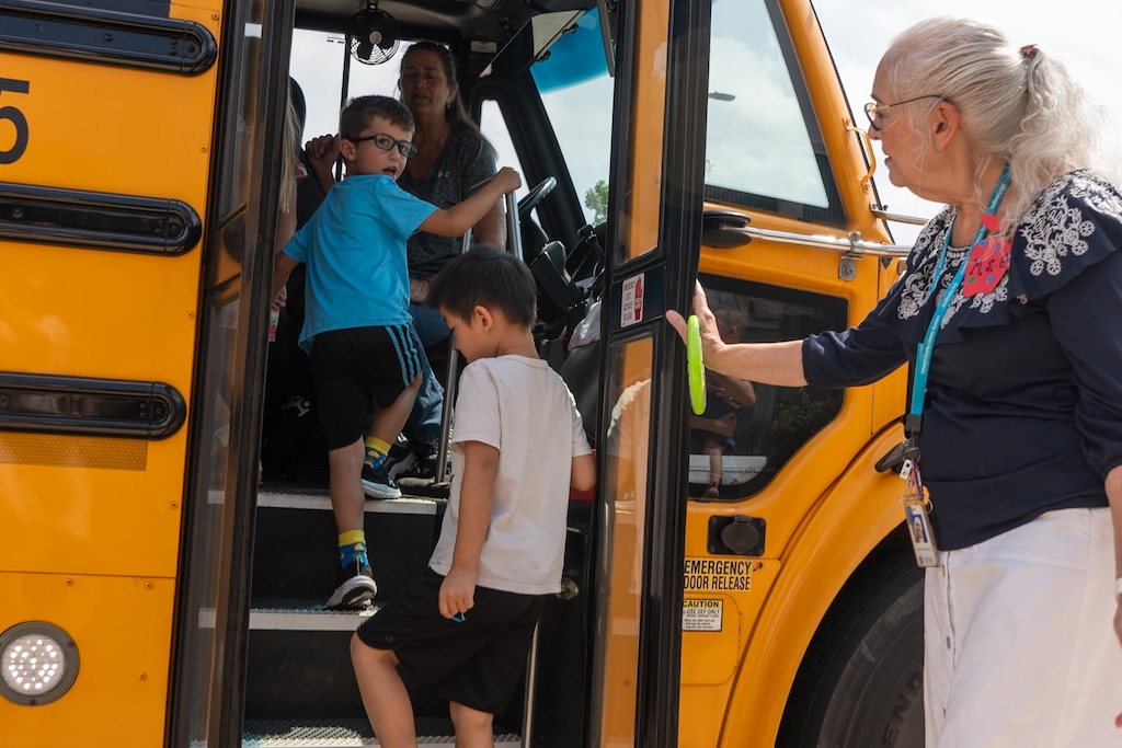Children practice boarding a bus at the Glenwood Branch of the Howard County Library while attending an event on July 30, 2024, that was designed to help them prepare to enter kindergarten.