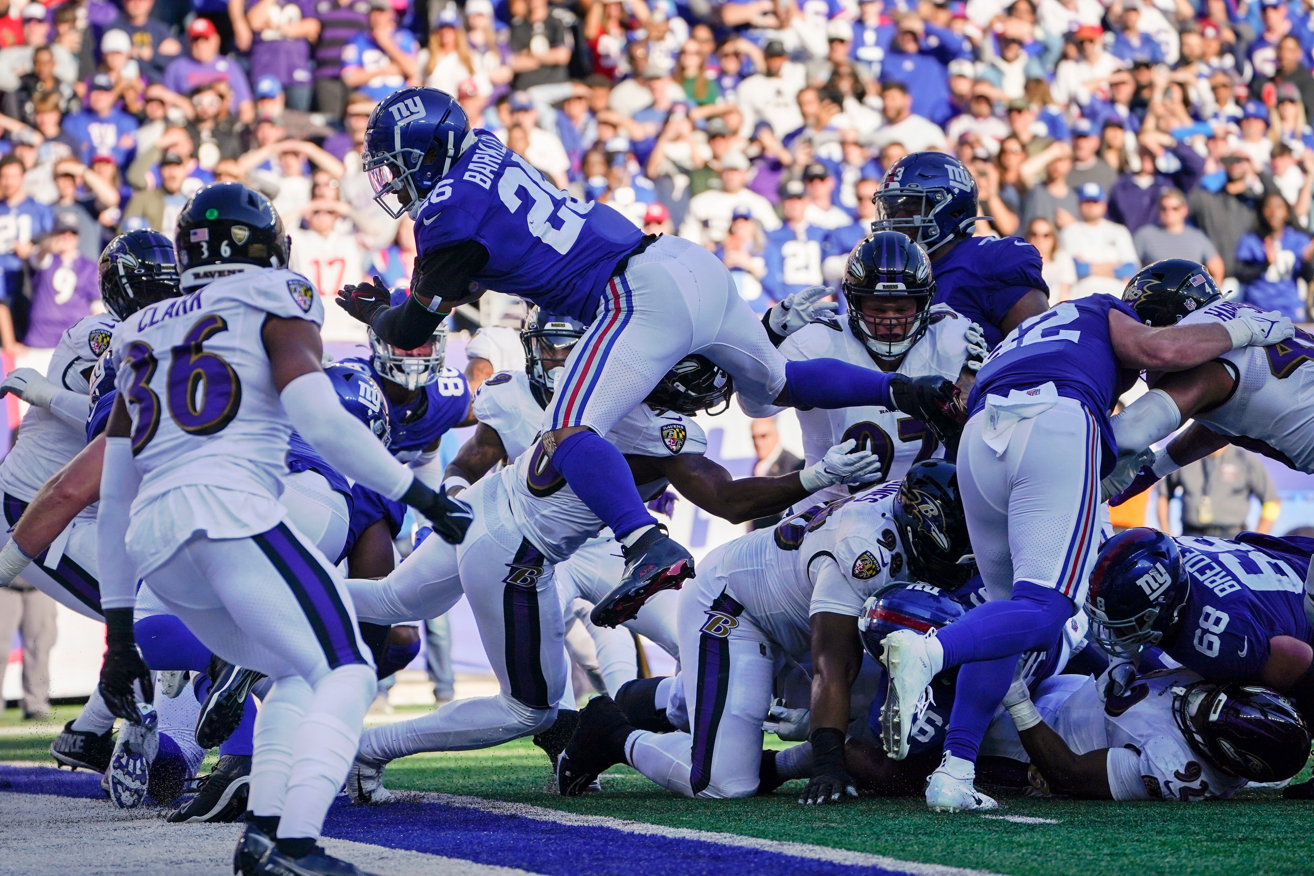 New York Giants' Saquon Barkley (26) dives into the end zone for a touchdown during the second half of an NFL football game against the Baltimore Ravens, Sunday, Oct. 16, 2022, in East Rutherford, N.J.