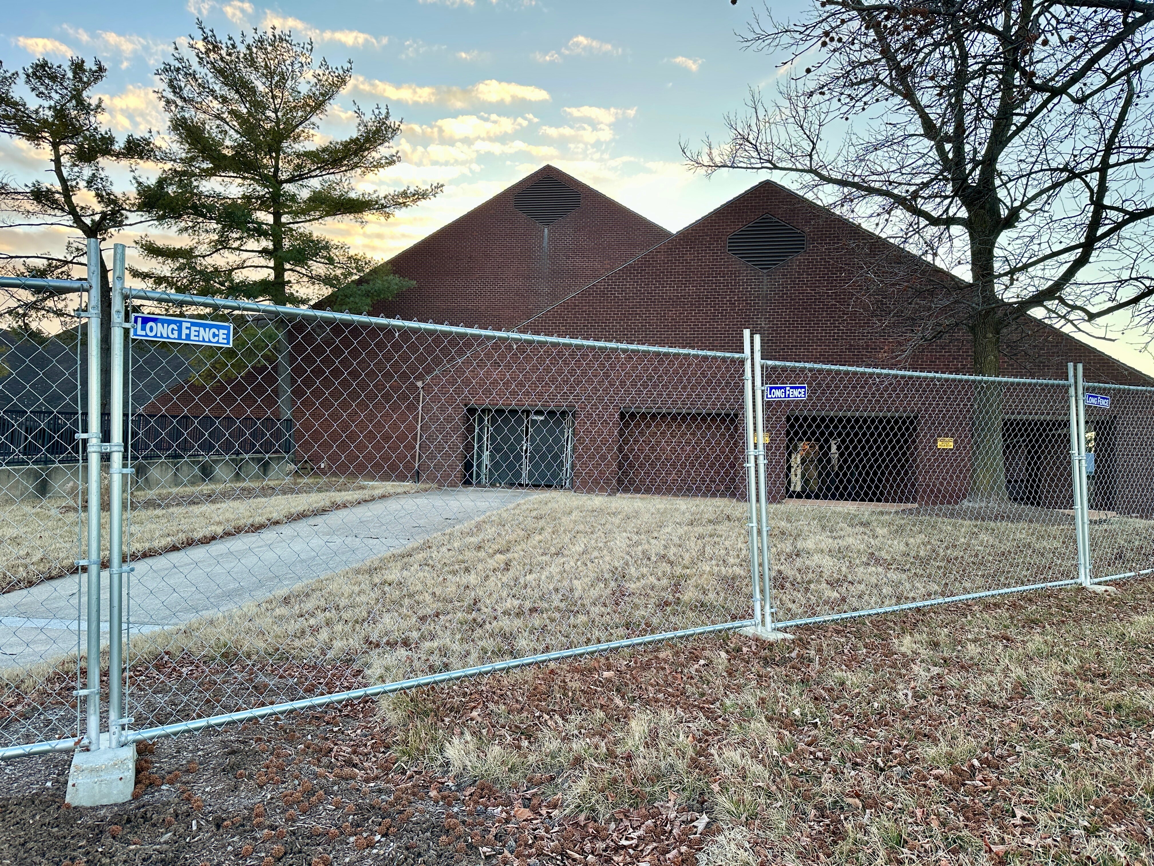 A chain-link fence surrounds the location of the former Hunt Valley Inn on Shawan Road. Developers hope to turn the site, which sits near I-83, two light rail stations and a large shopping center, into luxury townhomes.