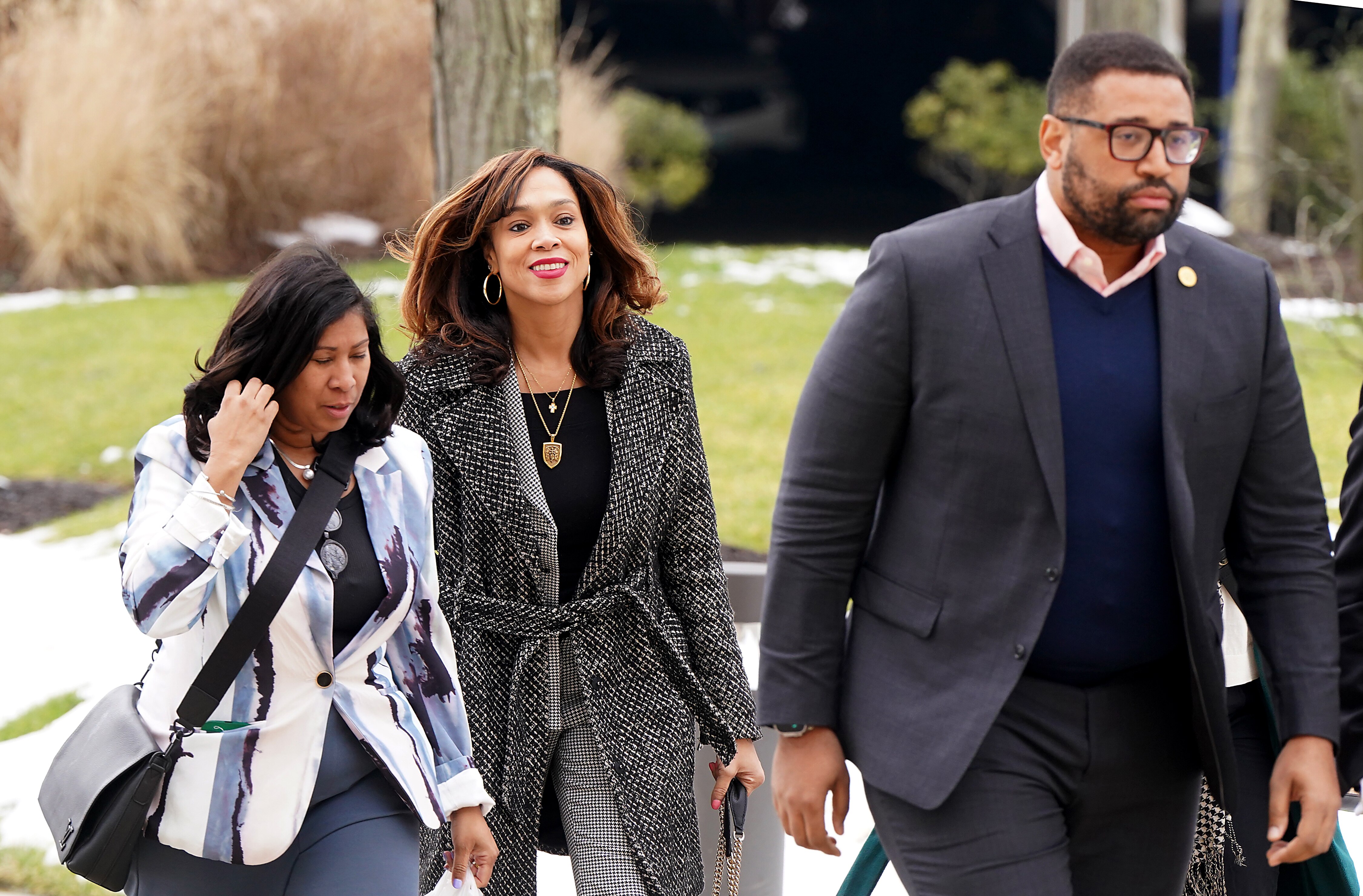 Former Baltimore State’s Attorney Marilyn Mosby, center, is standing trial in U.S. District Court in Greenbelt on two counts of making a false statement on a loan application. Federal prosecutors allege that she lied on mortgage applications for two luxury vacation homes in Florida.