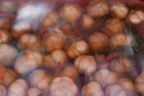 Pickled garlic behind the deli counter at the International Food Market on Reisterstown Road in Baltimore, Md. on Saturday, July 5, 2025.