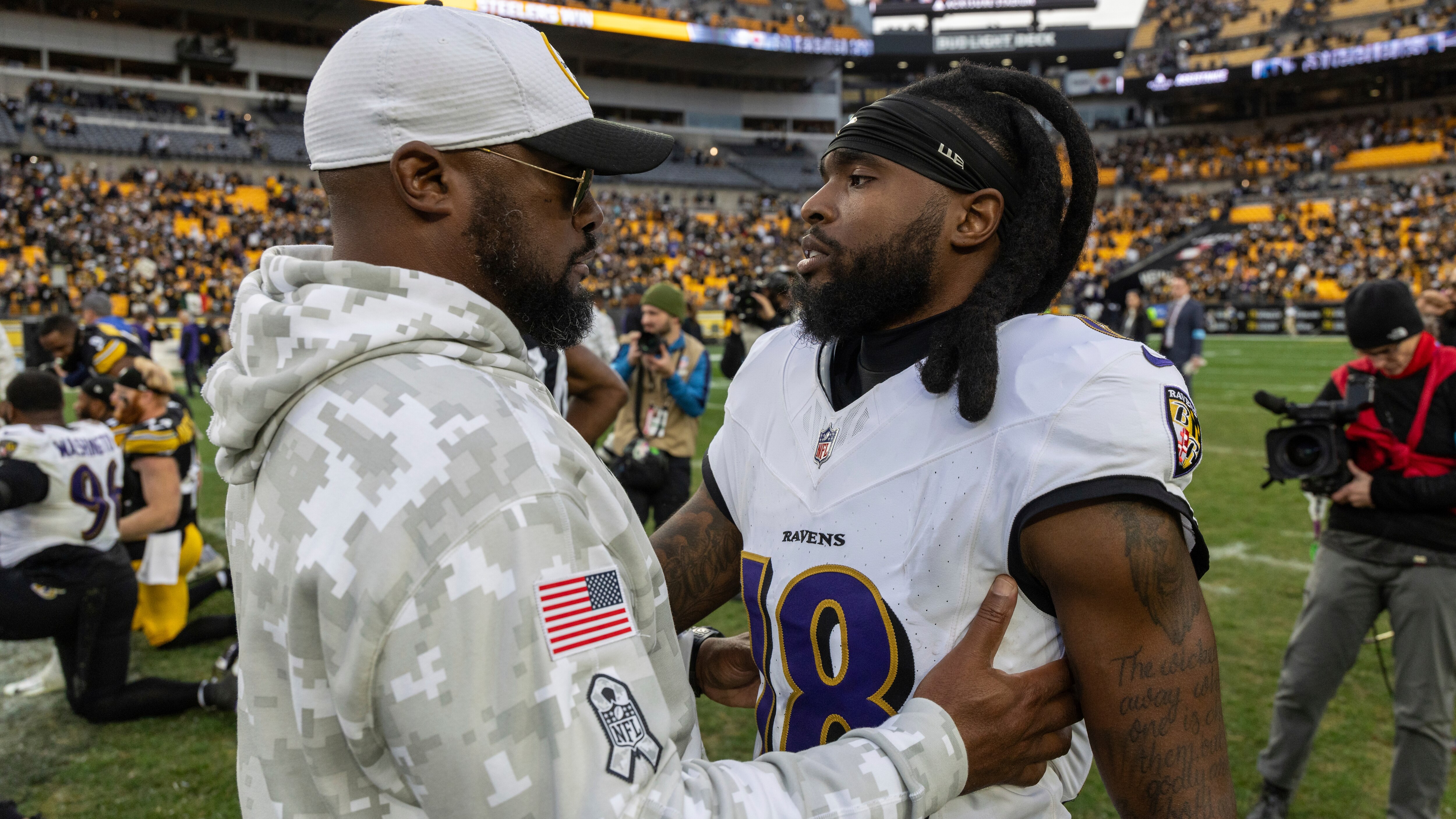 Pittsburgh Steelers head coach Mike Tomlin embraces Baltimore Ravens wide receiver Diontae Johnson (18) after an NFL football game, Sunday, Nov. 17, 2024, in Pittsburgh. (AP Photo/Matt Durisko)