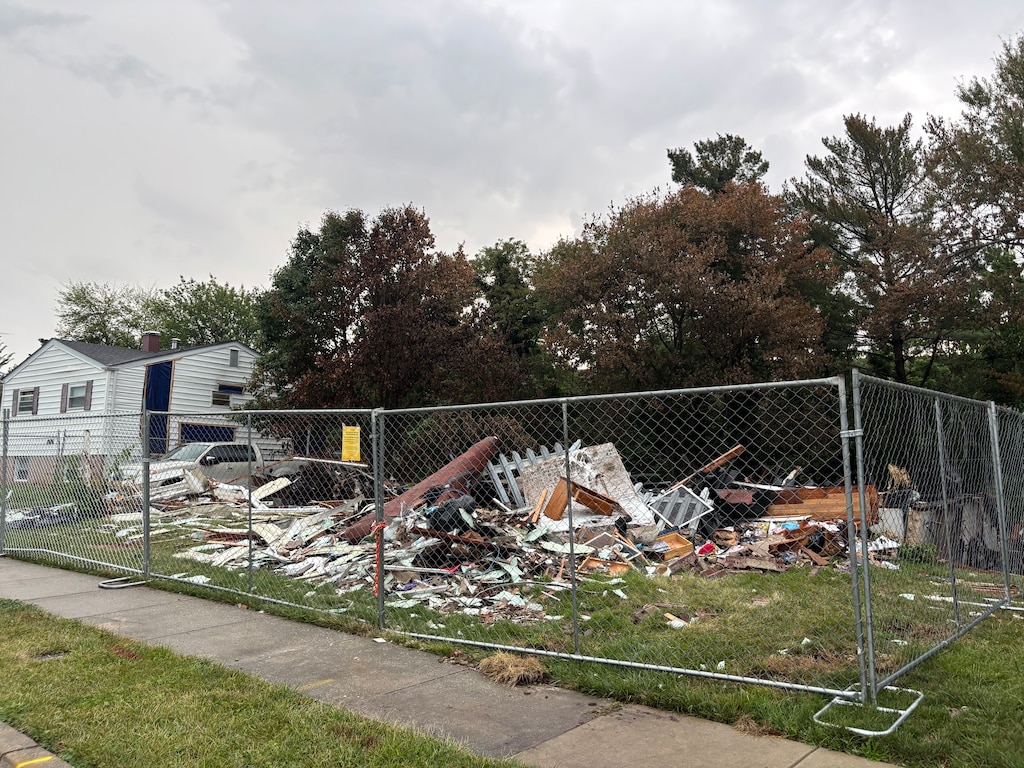 The charred remains of a home on Callo Lane, seen on July 8, 2025, days after a powerful explosion rocked the quiet Rosedale neighborhood.