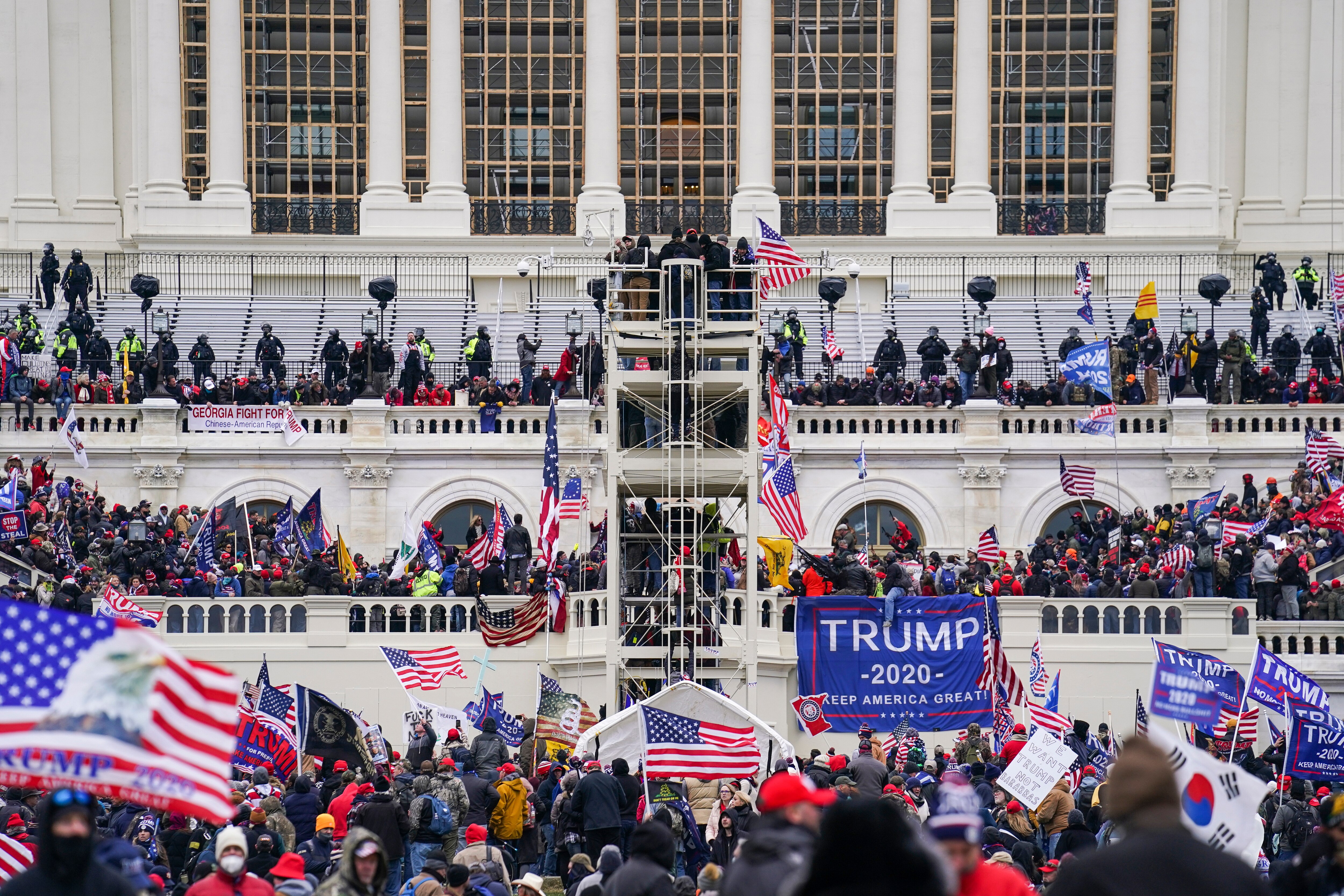FILE - Insurrectionists loyal to President Donald Trump breach the Capitol in Washington, Jan. 6, 2021. A North Carolina man pleaded guilty on Thursday, Oct. 6, 2022, to plotting with other members of the far-right Proud Boys to violently stop the transfer of presidential power after the 2020 election, making him the first member of the extremist group to plead guilty to a seditious conspiracy charge. Jeremy Joseph Bertino, 43, has agreed to cooperate with the Justice Department's investigation of the role that Proud Boys leaders played in the mob's attack on the U.S.