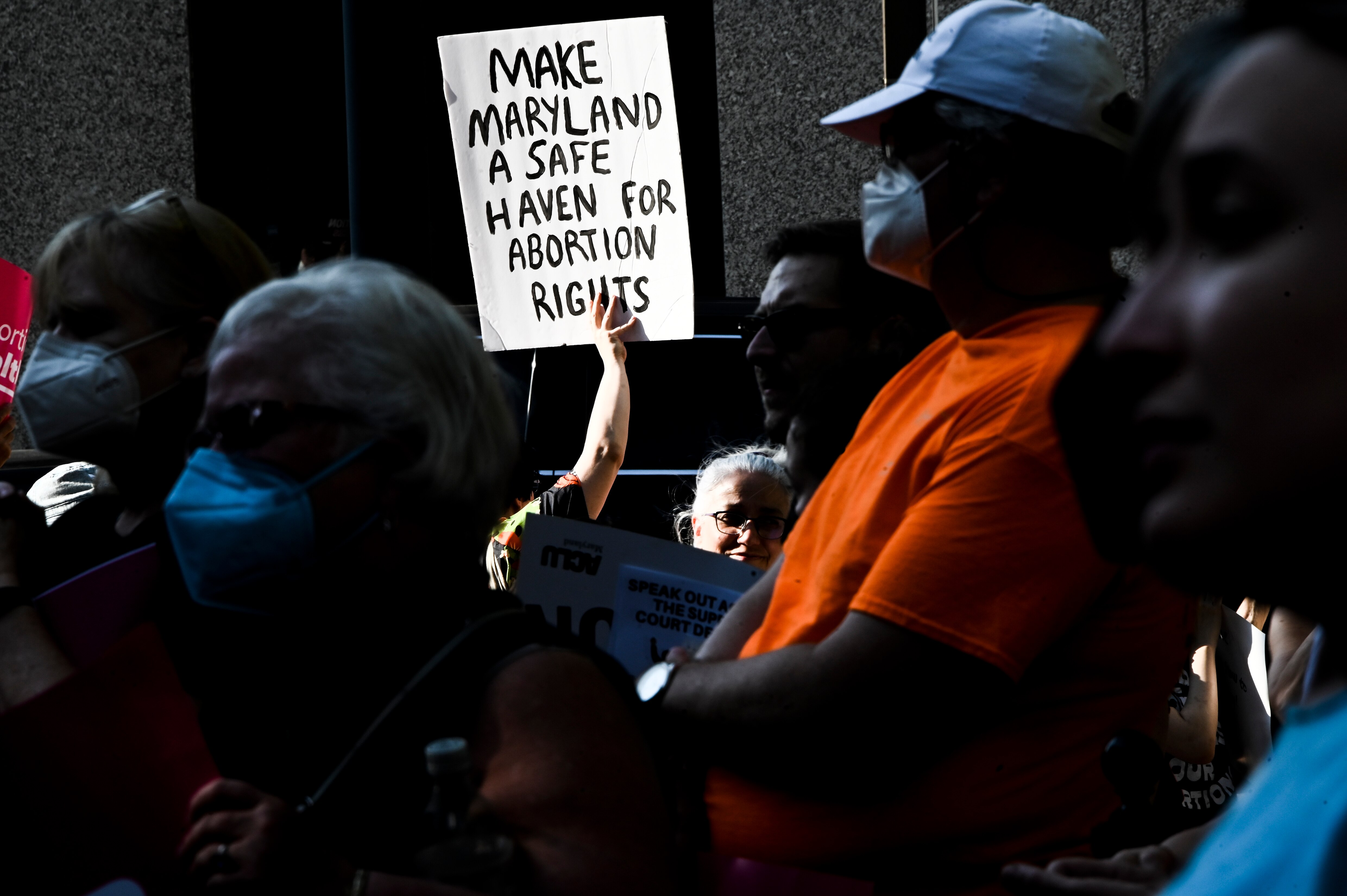 Supporters of the baltimore Abortion Fund and the Women's March attend a rally in protest of the overturning of Roe V. Wade at the federal courthouse in Baltimore.
