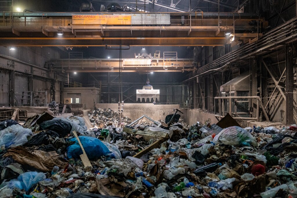 The refuse pit at WIN’s Waste-to-Energy facility in Baltimore measures about 80’ high, as seen on June 27, 2024. Two cranes are used to move the trash into boilers.