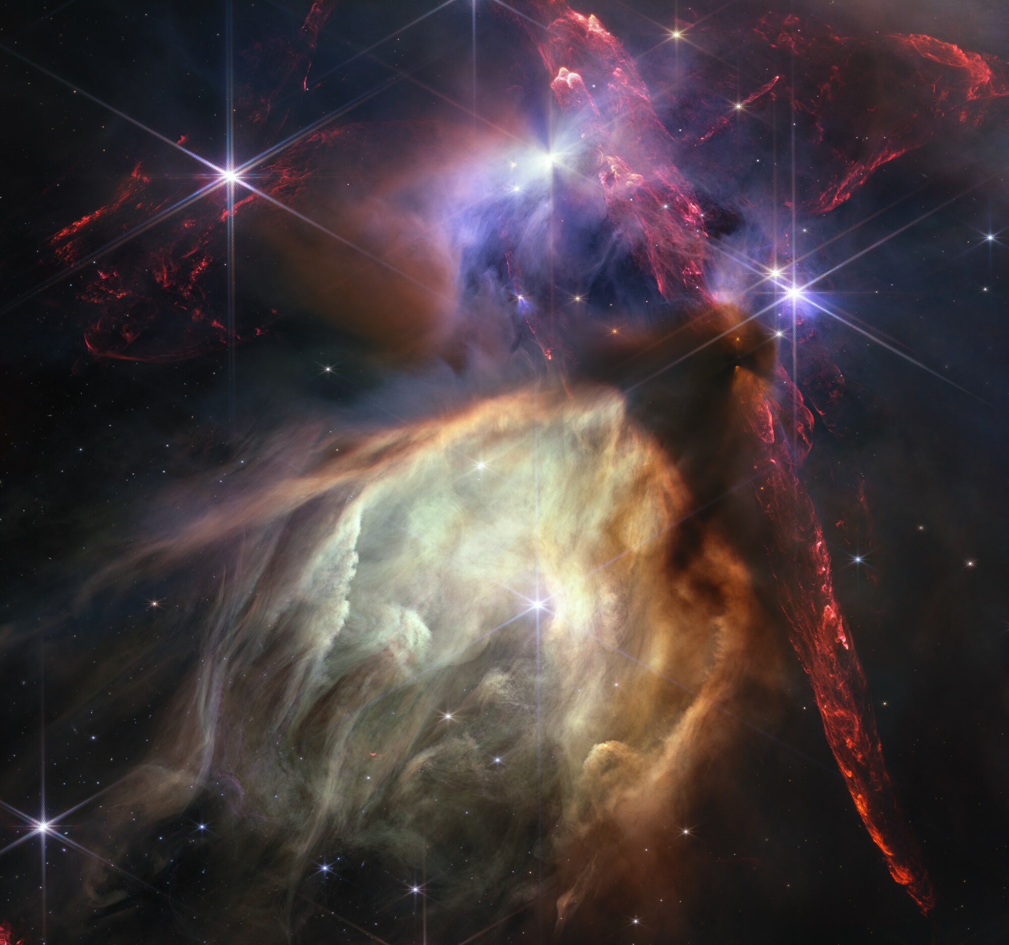 The first anniversary image from NASA’s James Webb Space Telescope displays star birth like it’s never been seen before, full of detailed, impressionistic texture. The subject is the Rho Ophiuchi cloud complex, the closest star-forming region to Earth.