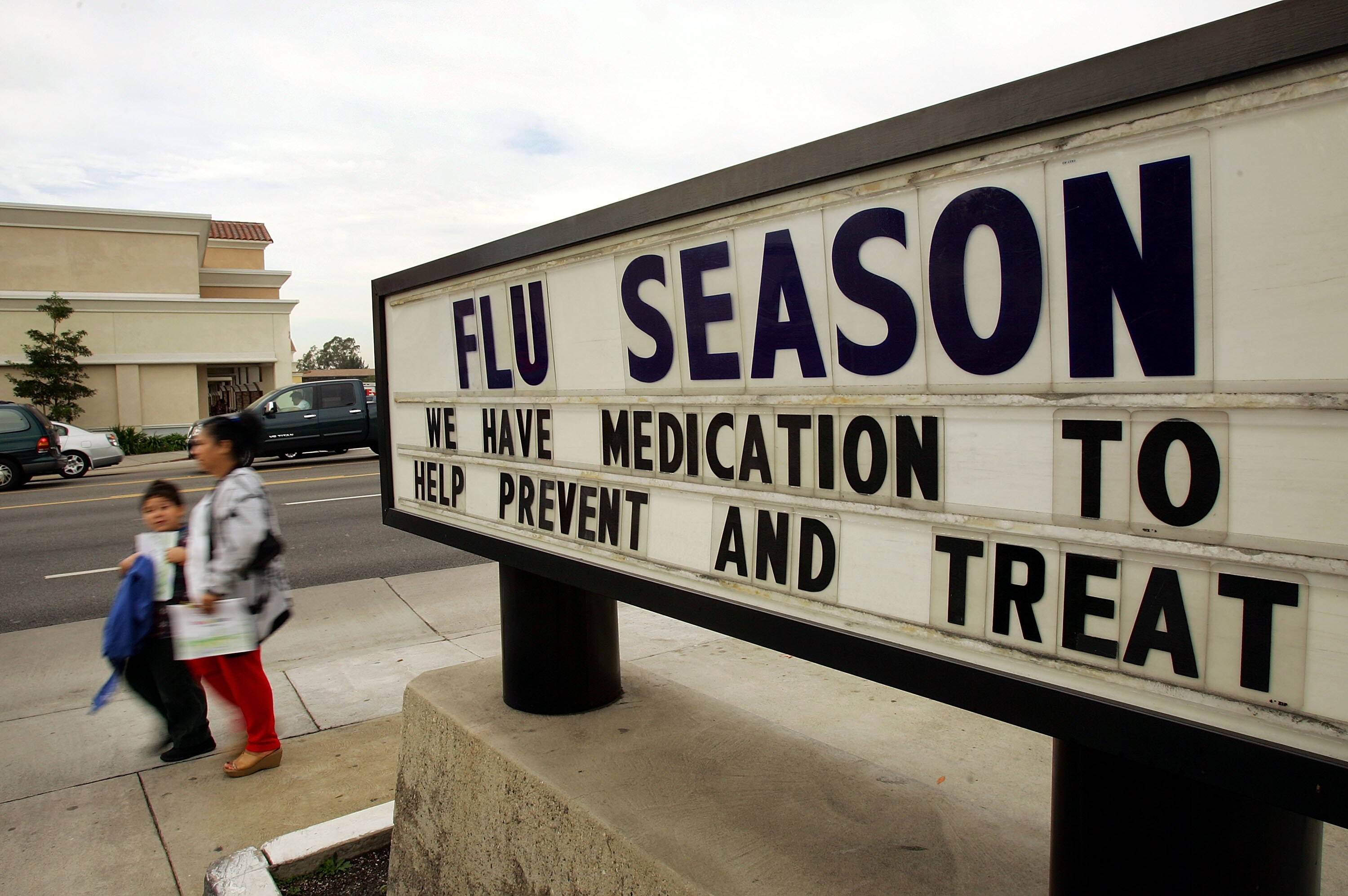 Pedestrians pass the Verdugo Hills Medical Clinic where many people are being treated for the flu on December 27, 2005 in Glendale, California. The annual arrival of the flu season has reportedly intensified over the holidays with spikes in influenza cases in California, Oregon, Arizona, New Mexico, Kansas, and Utah. Los Angeles and San Diego, California have been hit especially hard in the past two weeks. Nearly all the viruses so far come from a strain of influenza labeled A/California/07/2004, a flu virus first isolated in northern California last flu season, according to the federal Centers for Disease Control and Prevention.
