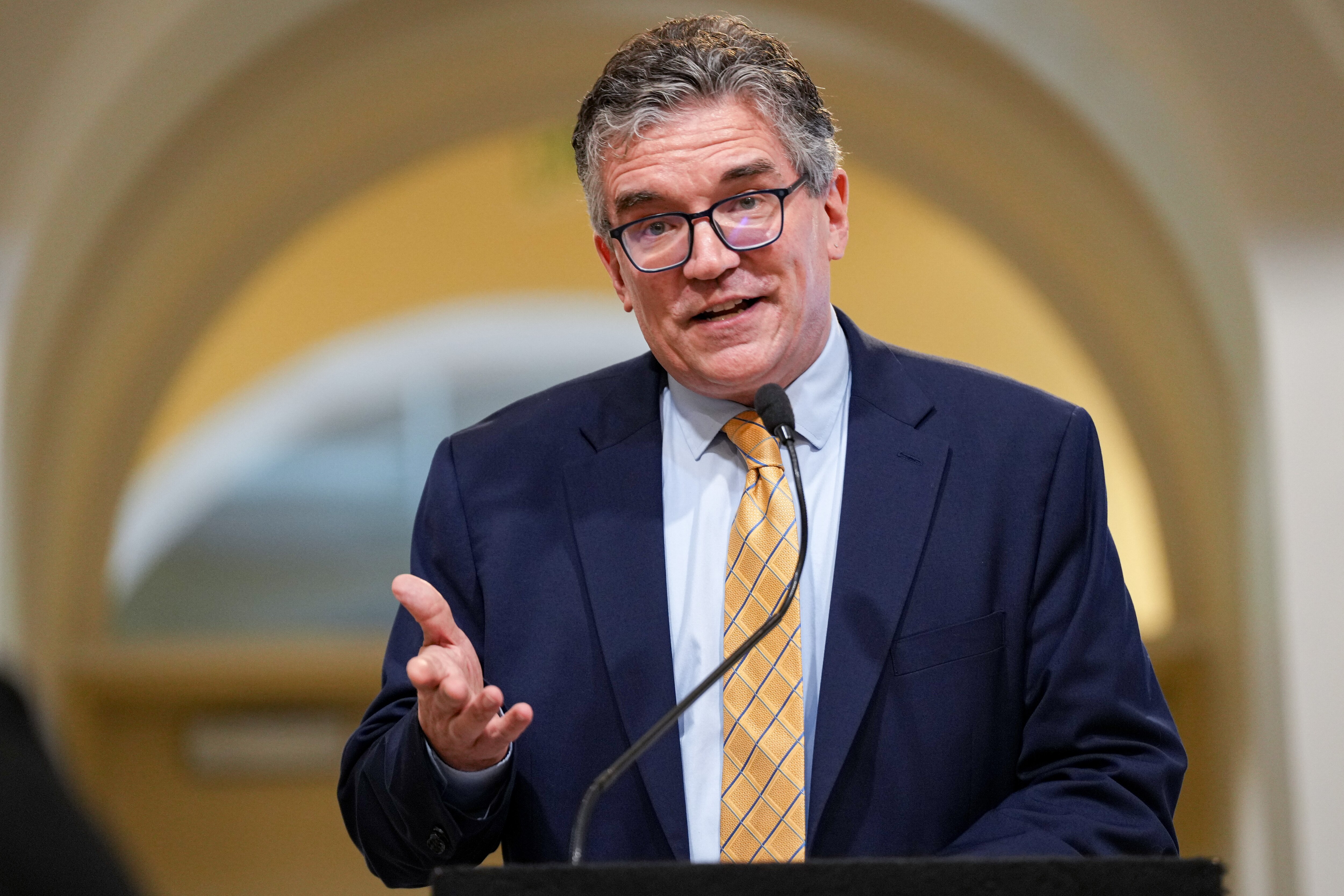 Kevin Lindamood, president and CEO of Healthcare for the Homeless, speaks at a news conference inside Baltimore City Hall. City leaders announced funding to continue and expand a pilot program providing permanent housing for nearly 300 city residents.