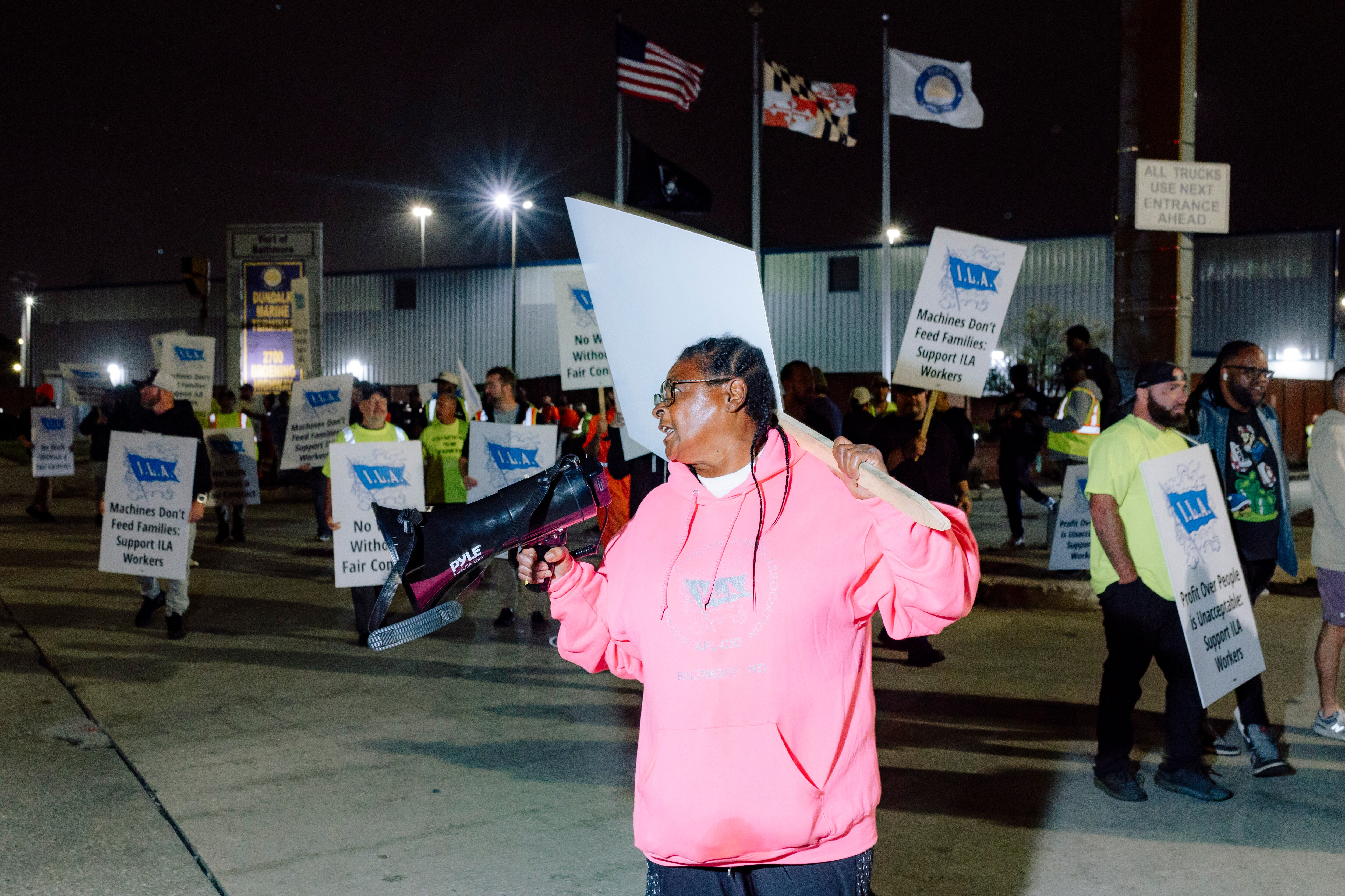 A Union member with the International Longshoremen’s Association and Local 333 leads chants outside the Dundalk Marine Terminal during a strike on Tuesday, October 1, 2024 in Baltimore, MD. Chants included, “What are we gonna do? Shut it down!” And “We want our money!”