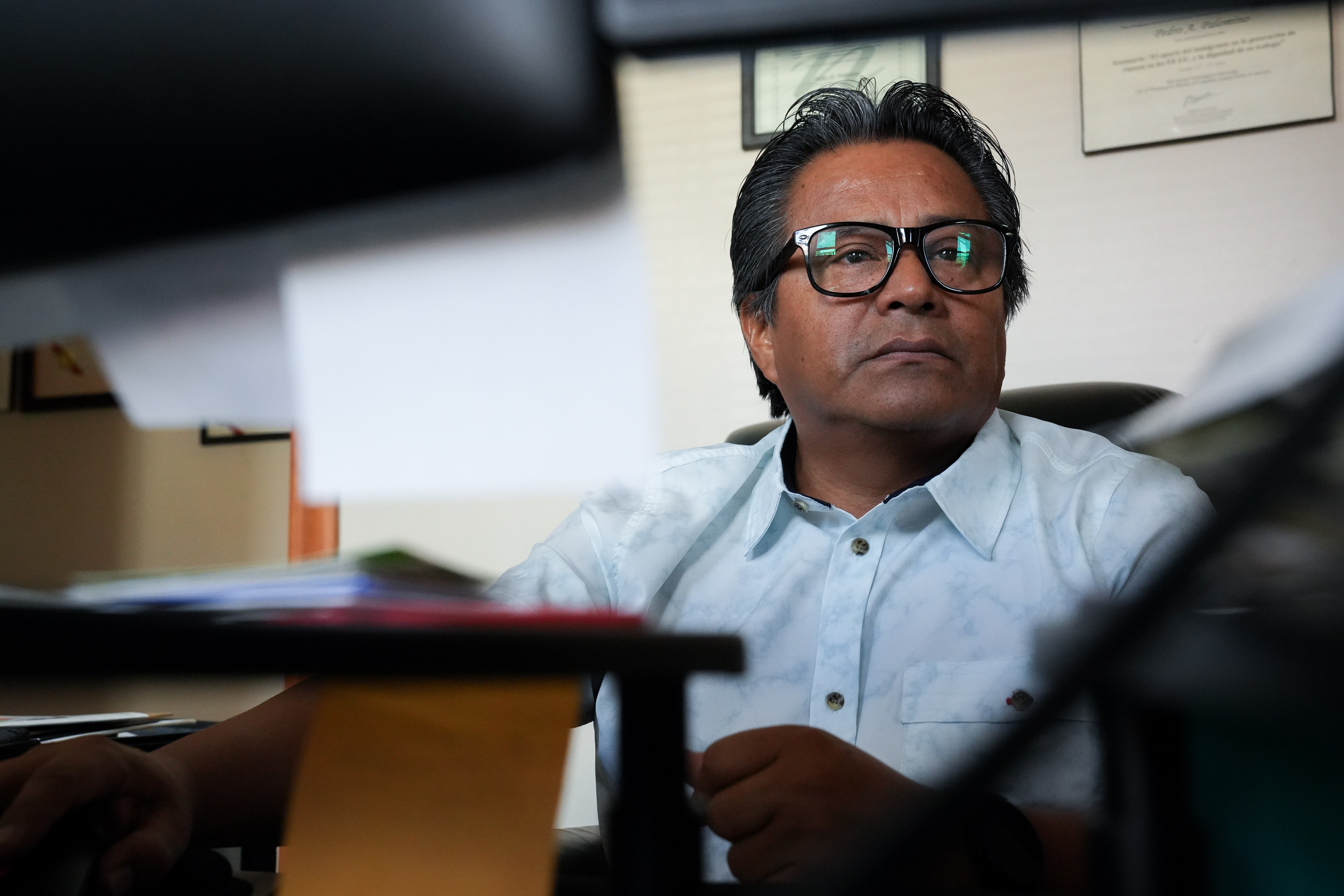 Pedro Palomino, editor of the Mundo Latino newspaper, works on his computer at the Somos Baltimore Latino/Mundo Latino office in Canton on 8/23/22.