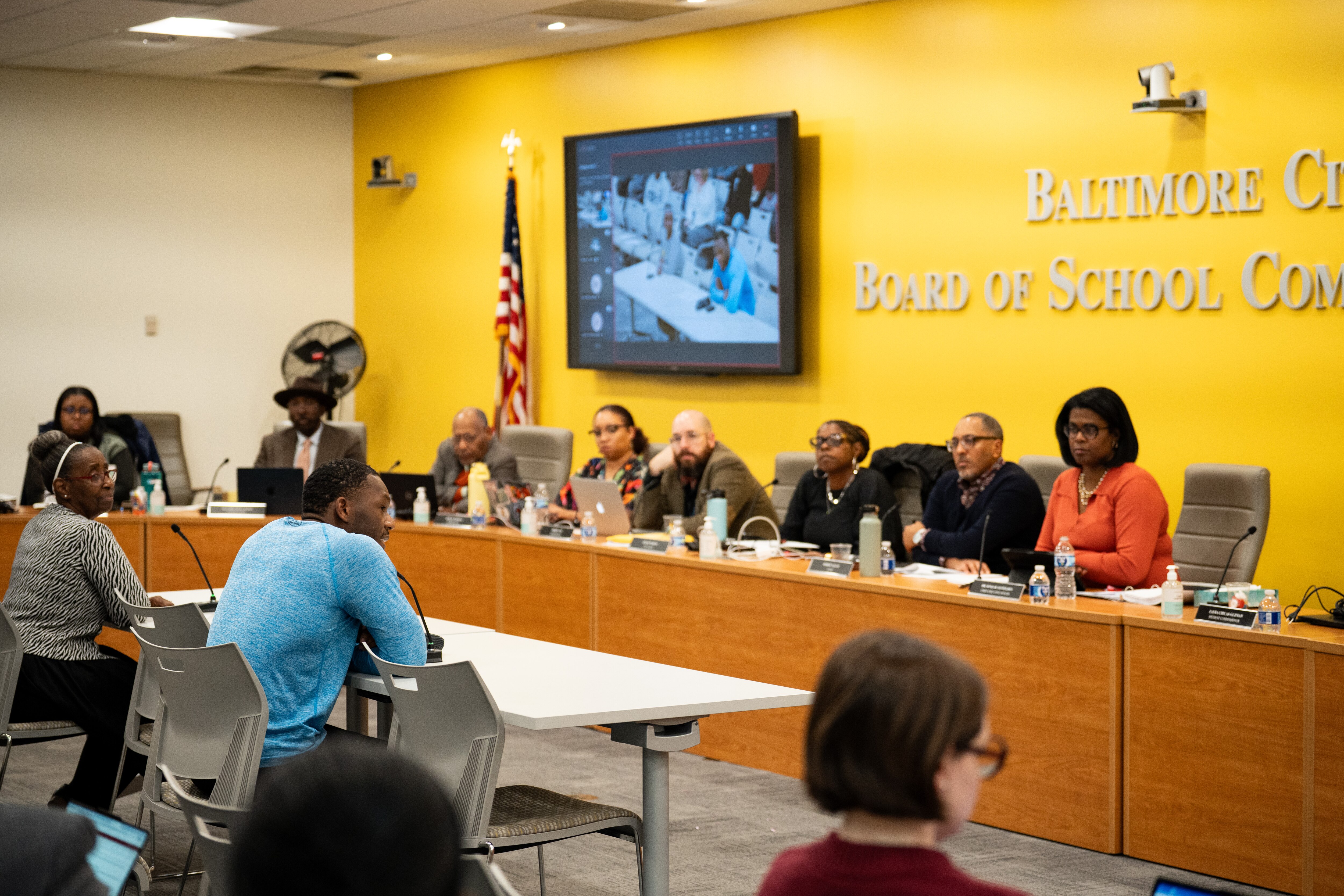 Lamar Richards addresses the Baltimore City Board of School Commissioners during the public comment period of the board meeting on Tuesday. Community members voiced concerns over the closure of New Song Academy.