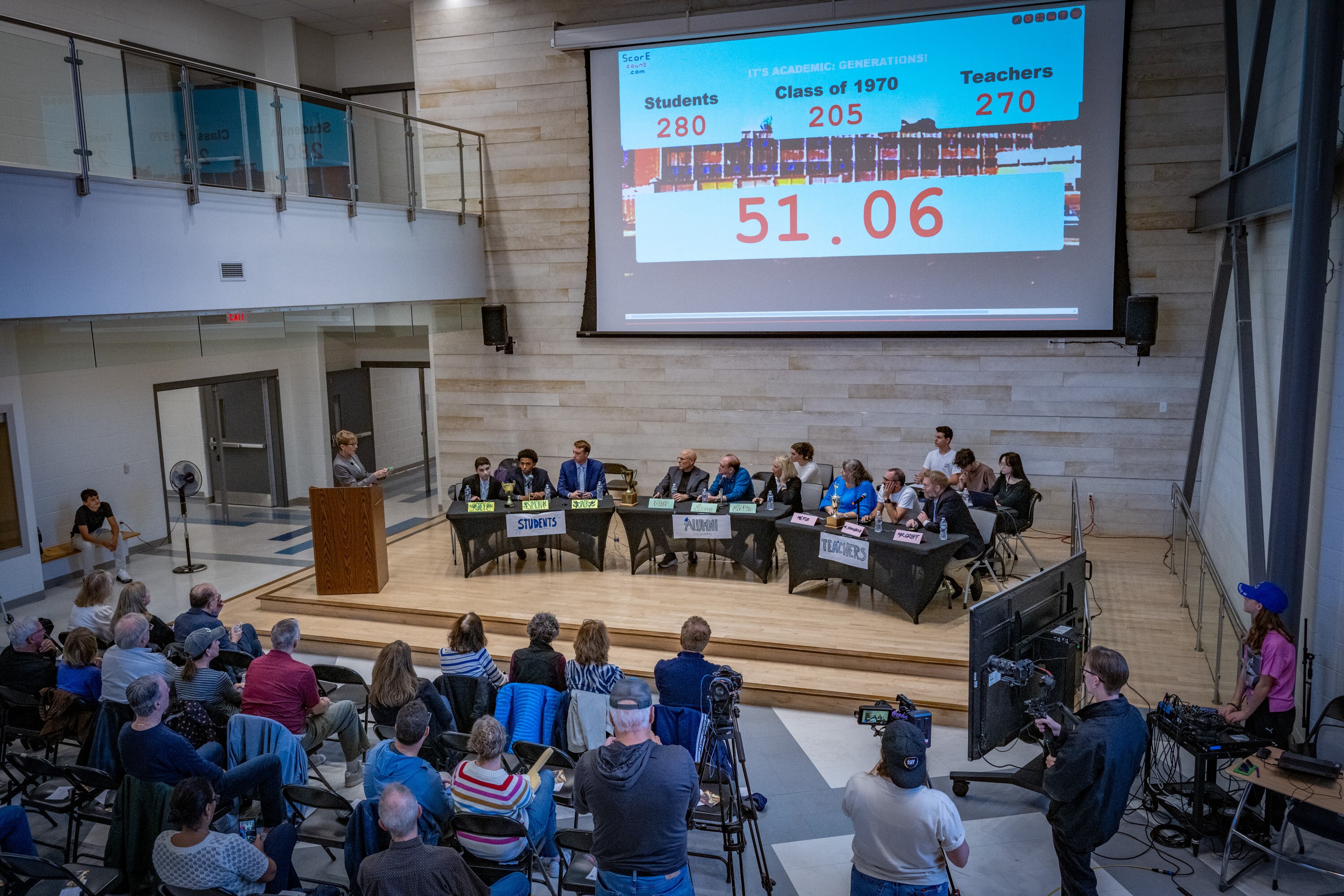 Host Hillary Howard, left, asks a question during a special “It’s Academic” quiz bowl between students, teachers and three members of the class of 1970 at Walt Whitman High School in Bethesda.
