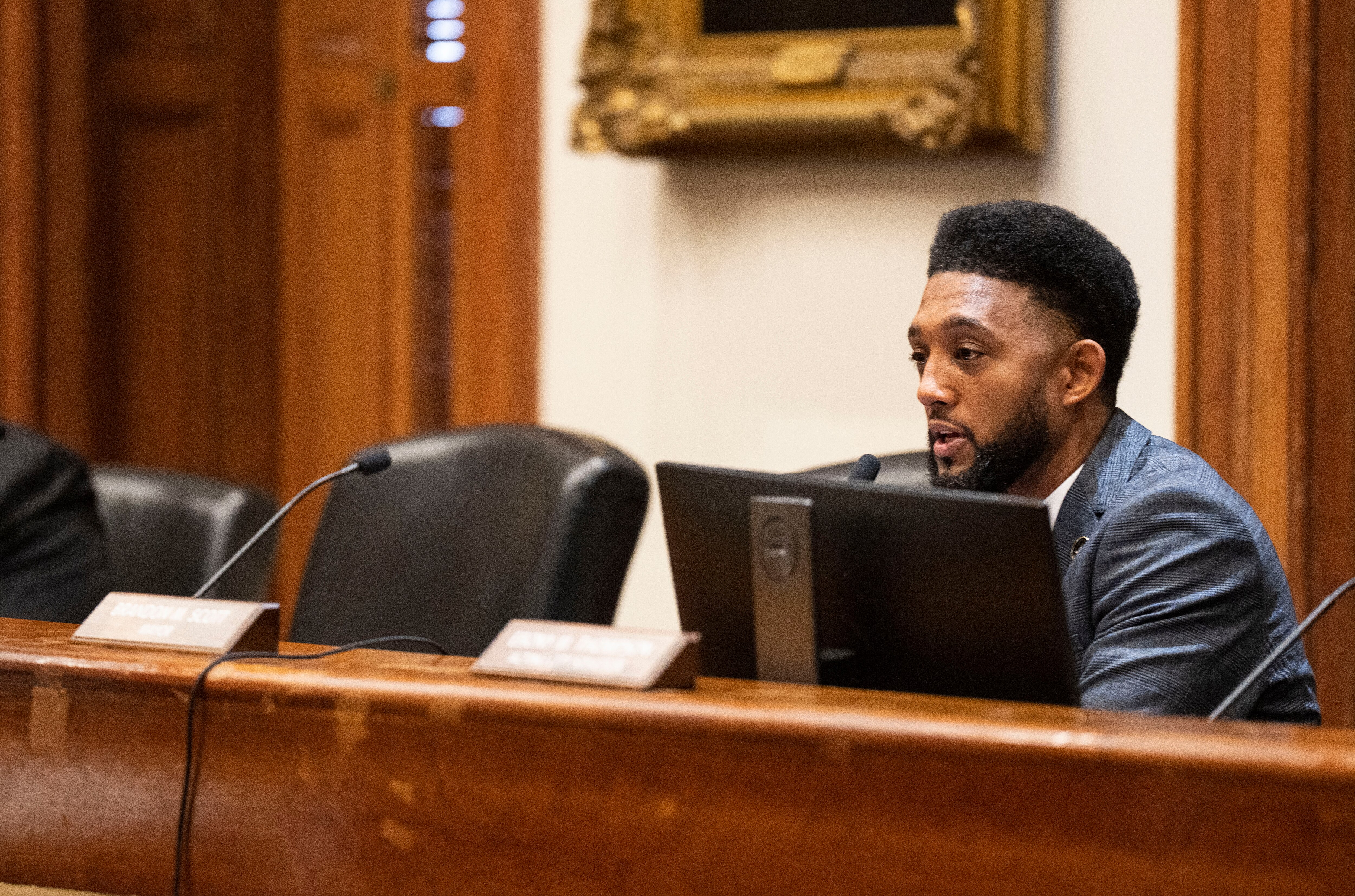 Mayor Brandon Scott sits next to the empty chairs of Nicholas Mosby and Bill Henry both who opted not to attend the Board of Estimates meeting in an effort to defer the vote on the citiy’ purposed contract with BGE, at City Hall in Baltimore, February 15, 2023.