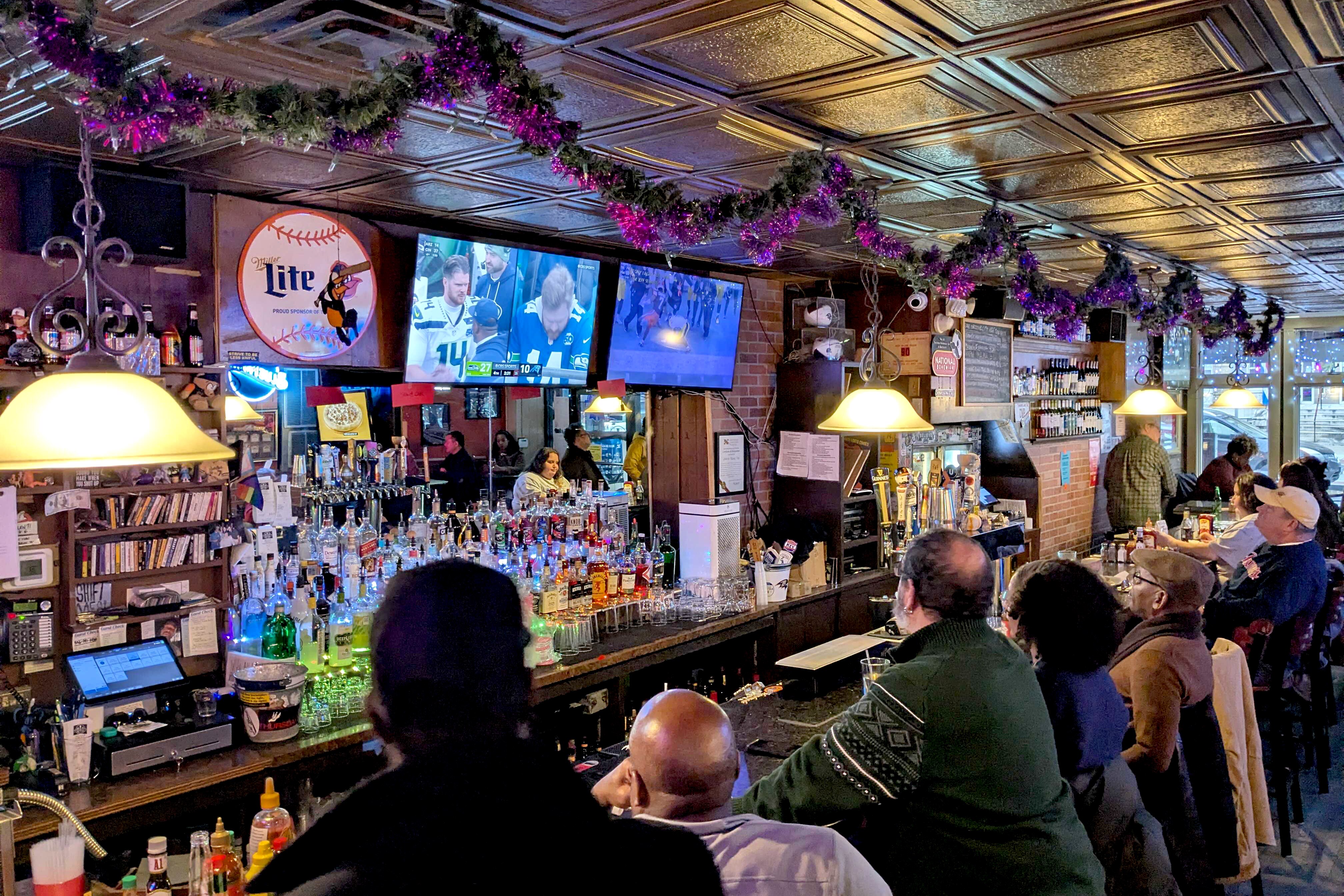 Patrons at the Charles Village Pub watch the fourth quarter of the Browns-Steelers game on Sunday.