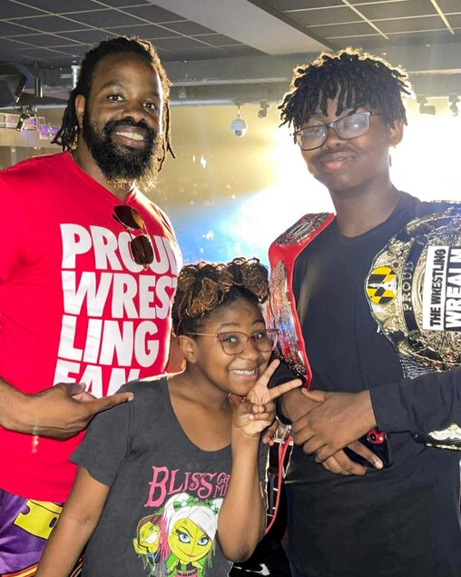 Brian H. Waters with his kids Jonathan Ford and Aryanna Waters at WWE Raw in July 2023.