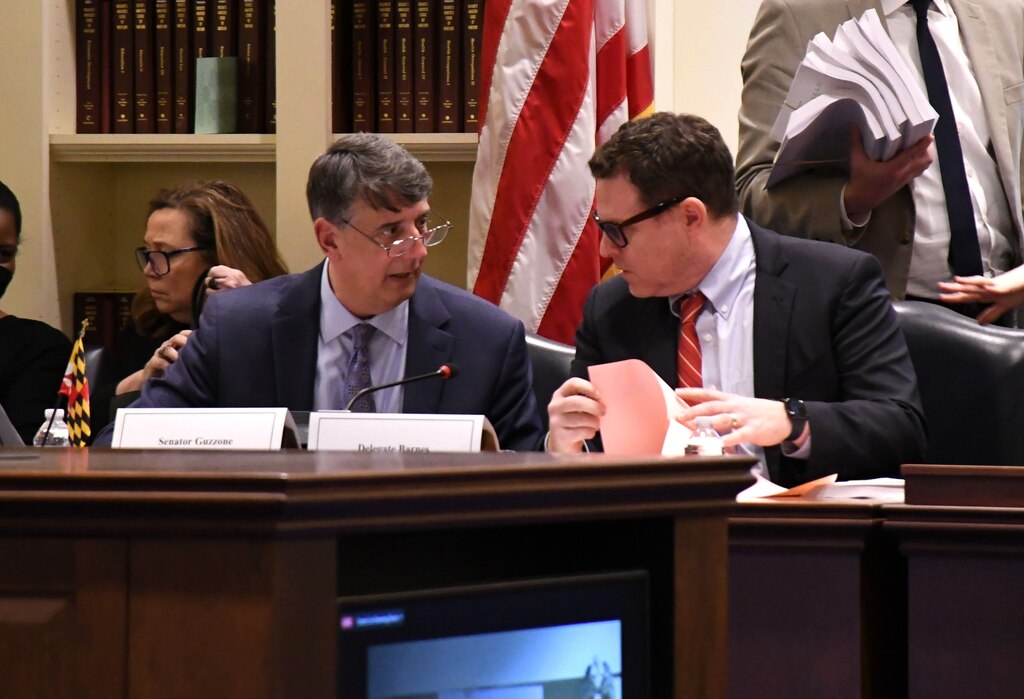 Maryland Sen. Guy Guzzone, left, talks with Del. Ben Barnes ahead of leading a meeting of the General Assembly's budget conference committee on Wednesday, March 27, 2024. The House of Delegates and state Senate have multiple differences on the budget they need to iron out.