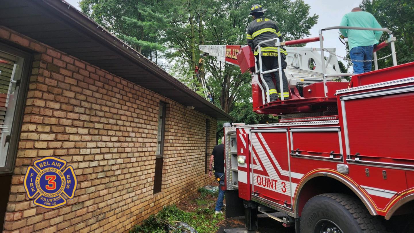 A piece of the tree fell on a man doing trimming work in his yard, leaving him stuck about 30 feet up on Aug. 7, 2024 in Harford County. Firefighters used a neighbor’s hydraulic lift to rescue the man, who was not seriously injured.