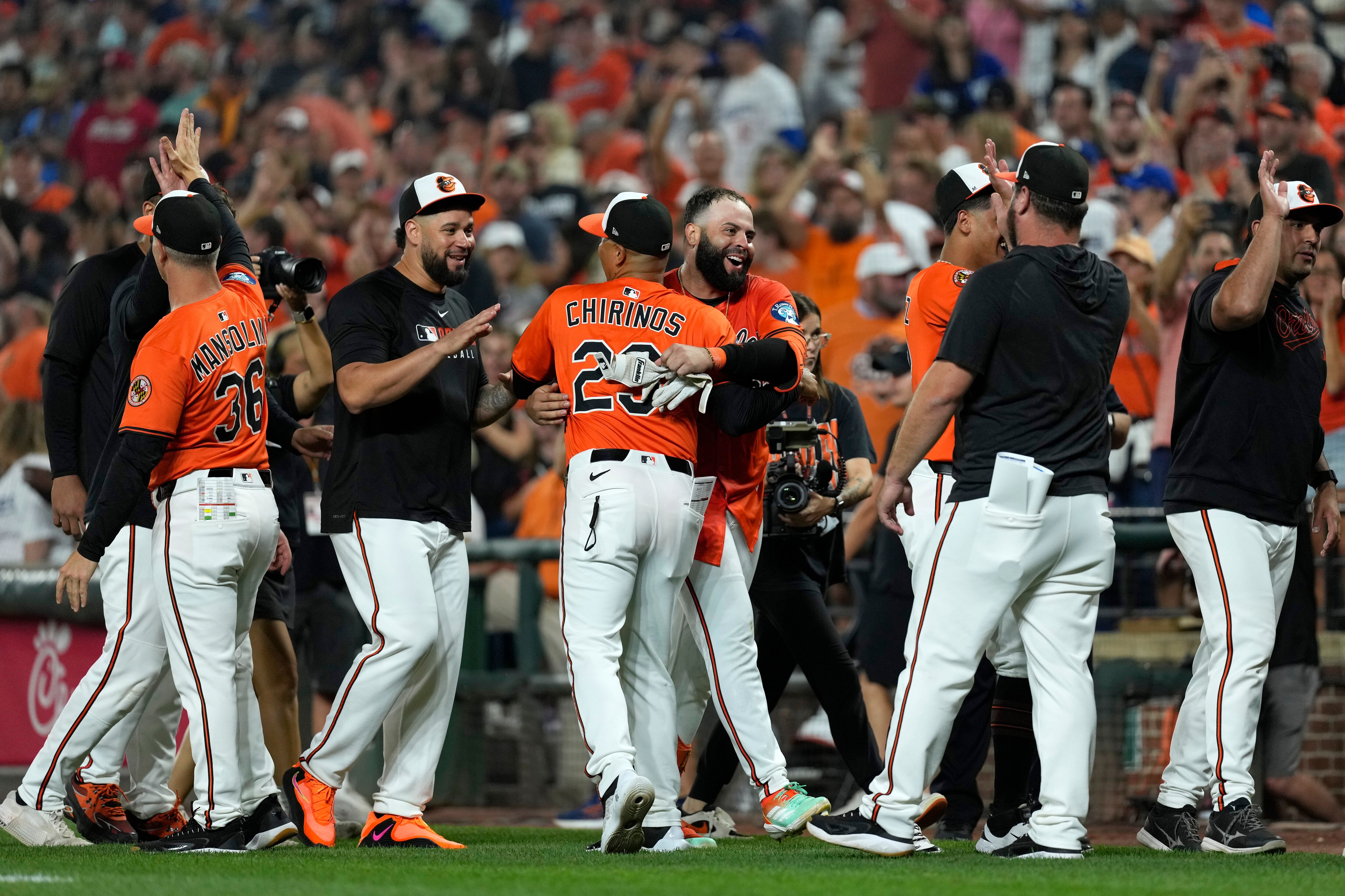 BALTIMORE, MARYLAND - SEPTEMBER 06: Emmanuel Rivera #26 of the Baltimore Orioles celebrates with Robinson Chirinos #23 after hitting a single in the ninth inning to walk off the Los Angeles Dodgers at Oriole Park at Camden Yards on September 06, 2025 in Baltimore, Maryland.