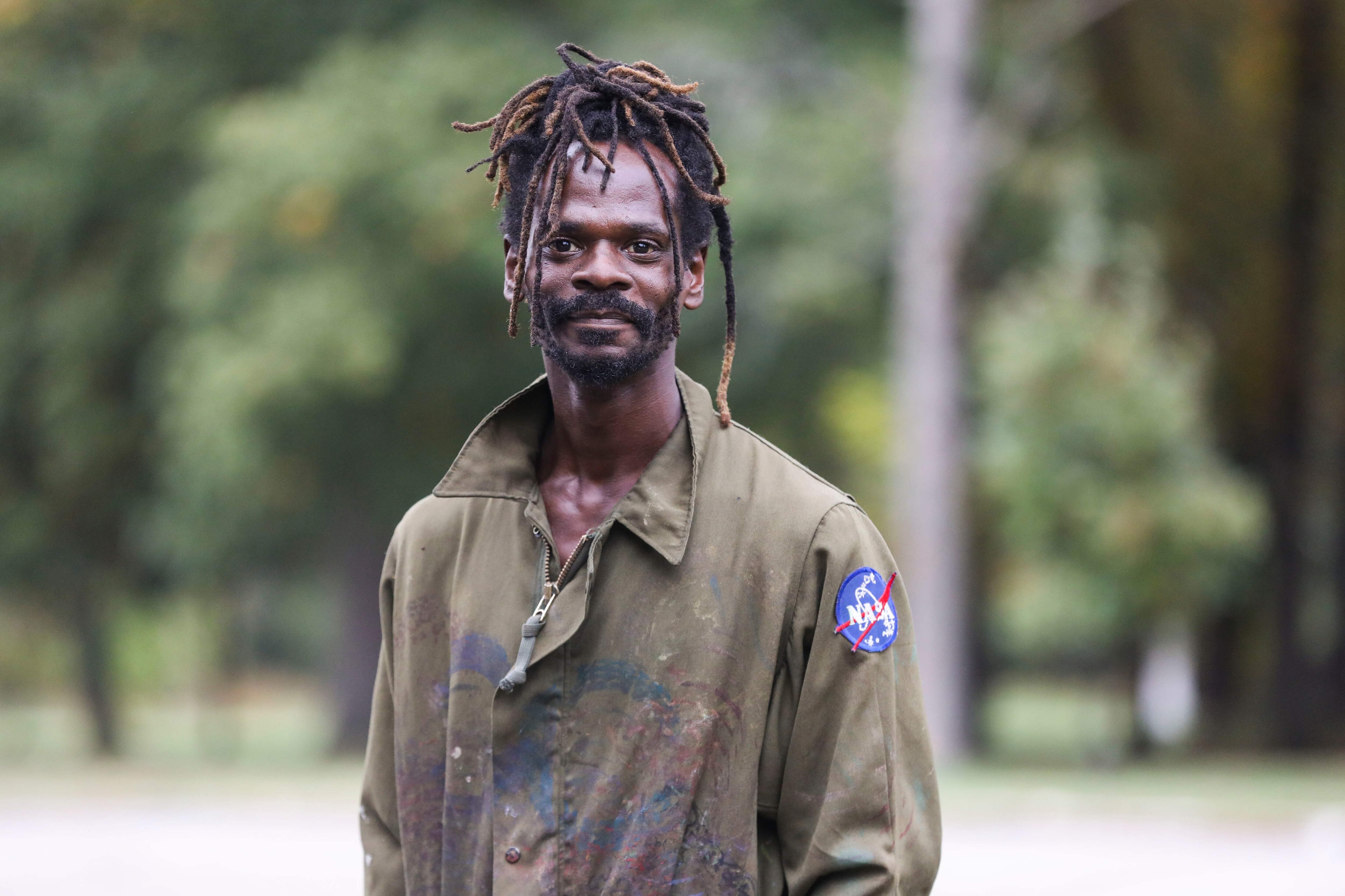 Colin Williams lives in Druid Hill Park and creates a sculpture garden out of a variety of tossed objects he finds such as TVs, glass, wood, mannequins and fabric. Every week he deconstructs his sculptures and creates new ones from the same materials, so the garden is always different. His favorite pieces are made of TV screens and spraypainted;these pieces come to life when the sun shines through them.