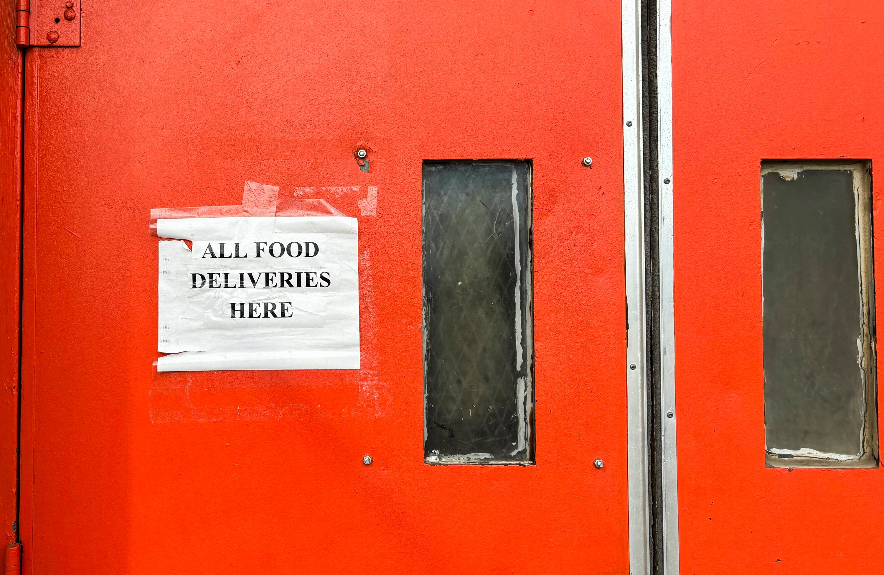 Students order food from mobile delivery apps for lunch at Baltimore City College.