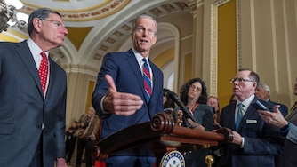 Senate Majority Leader John Thune, R-S.D., joined at left by Sen. John Barrasso, R-Wyo., speaks to reporters after a closed-door meeting with fellow Republicans, at the Capitol in Washington, Tuesday, Dec. 9, 2025. (AP Photo/J. Scott Applewhite)