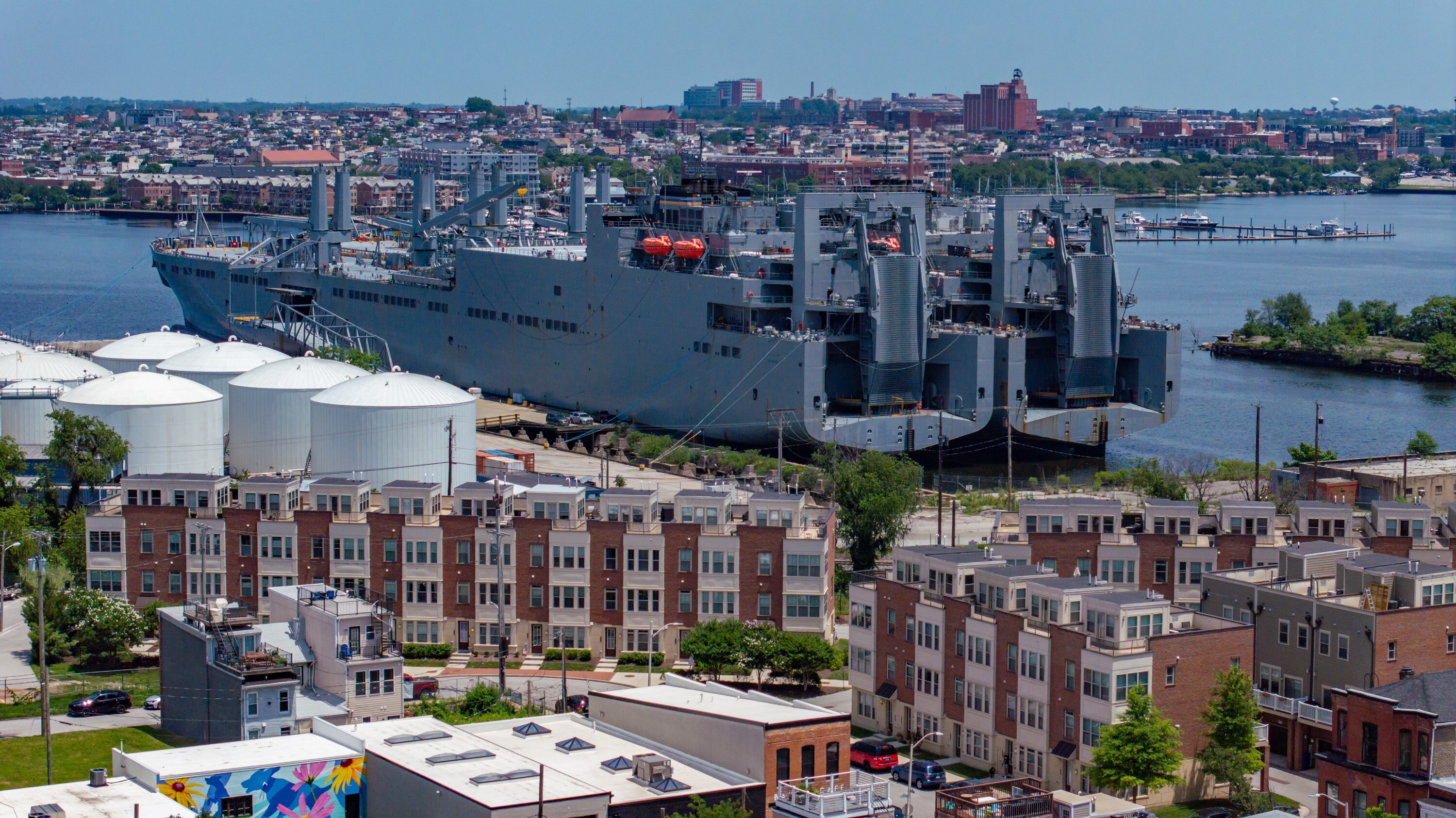 A pair of huge Navy ships, the USNS Charlton, left, and the USNS Pomeroy, docked near residential homes at North Locust Point on June 5. Since then, residents say that the ships have never turned off the engines -- meaning that they are always making tons of noise, shining bright lights into people's windows, and making the air all smelly with diesel.