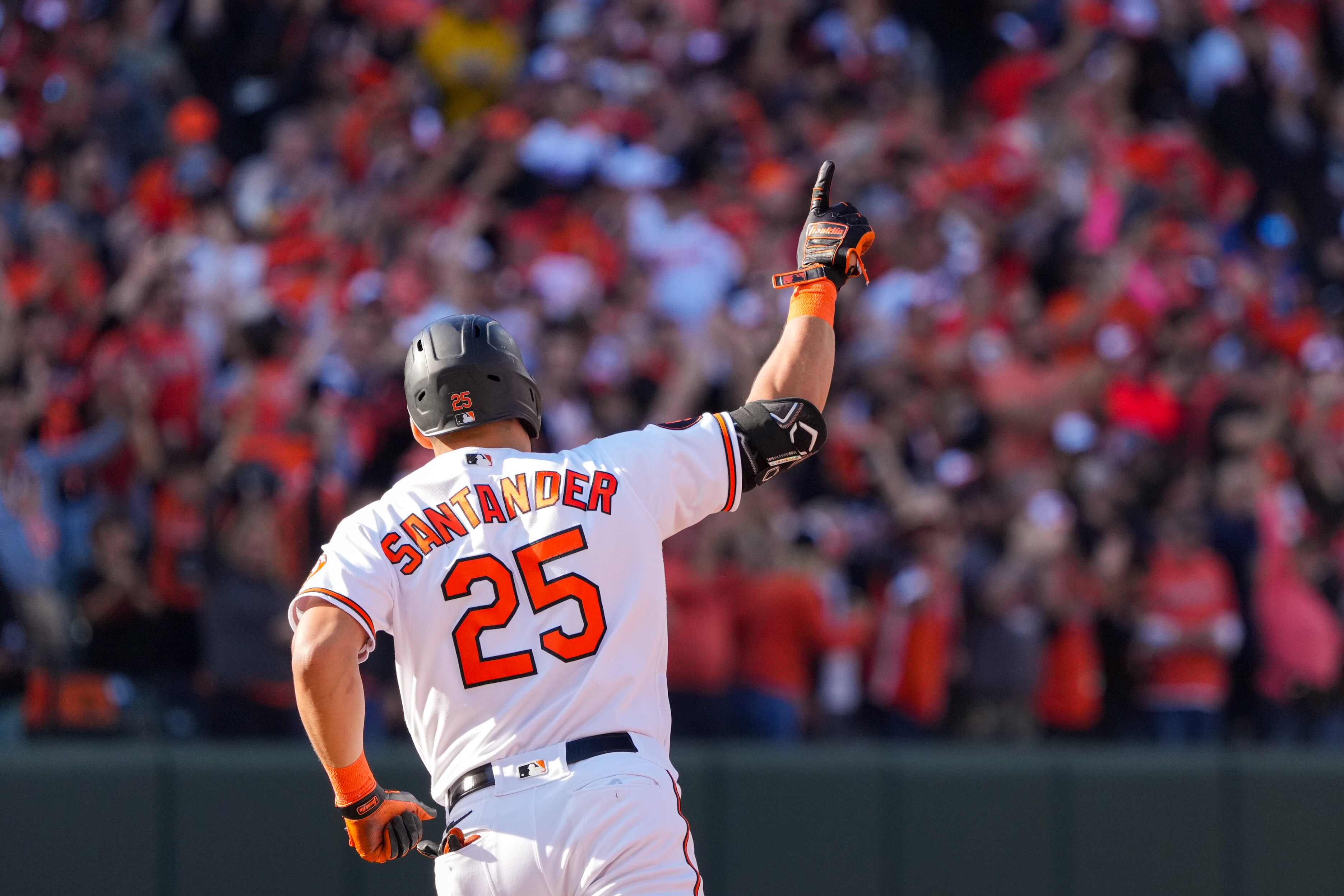 Baltimore Orioles right fielder Anthony Santander (25) points to the sky as he rounds the bases after homering in game one of the American League Divisional Series against the Texas Rangers at Camden Yards on Saturday, Oct. 7, 2023.