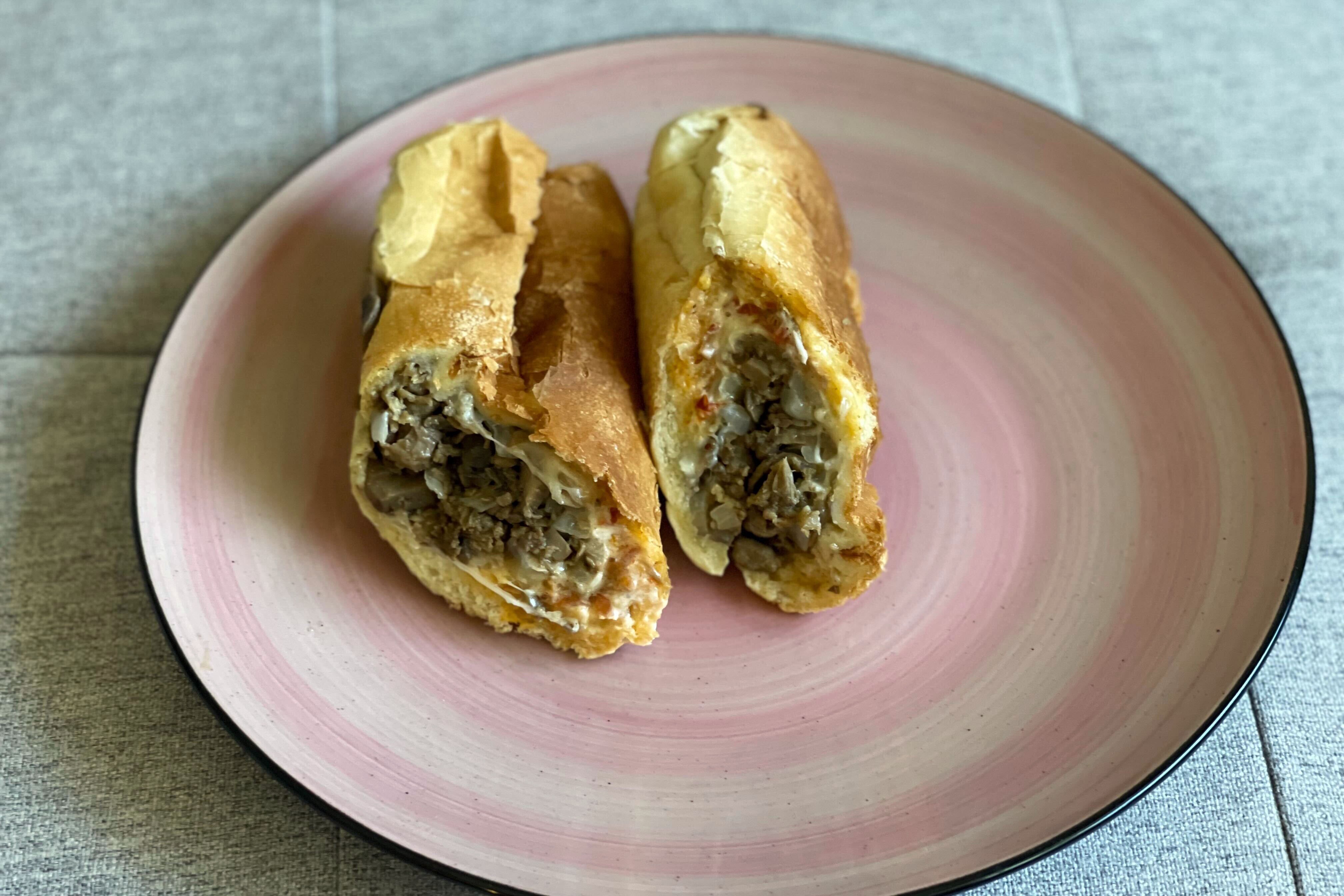 A Loch Raven Stokos’ cheesesteak consisting of provolone cheese, mayonnaise, hots and mushrooms.