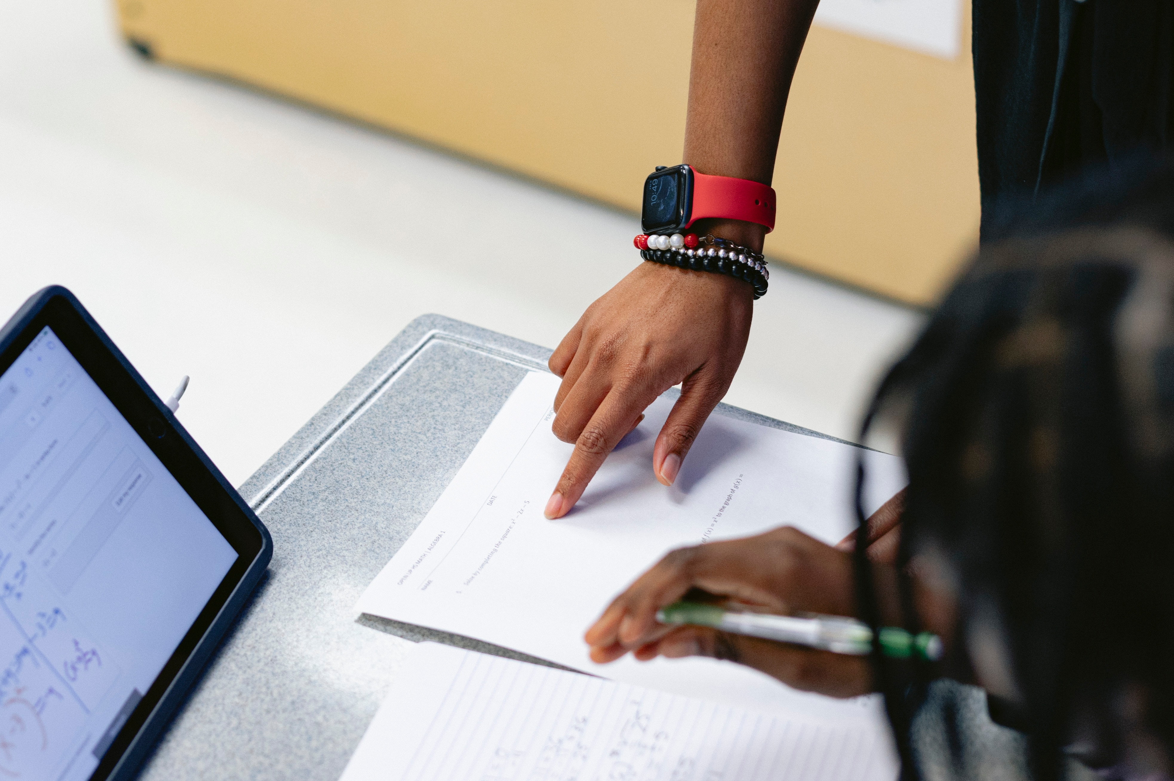 Pocomoke High School math teacher La'Tier Evans helps a student with an algebra assignment in her classroom on Friday, Dec. 8, 2023 in Pocomoke City, MD. Evans was inspired to teach after having a Black teacher in the eighth grade, and is now Worcester County’s only Black secondary math teacher.